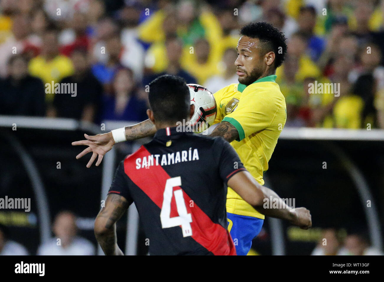 Los Angeles, California, USA. 10th Sep, 2019. Brazil forward Neymar Jr. (10) controls the ball Peru defender Anderson Santamaria (4) during an International Friendly Soccer match between Brazil and Peru at the Los Angeles Memorial Coliseum in Los Angeles on Tuesday, September 10, 2019. Credit: Ringo Chiu/ZUMA Wire/Alamy Live News Stock Photo