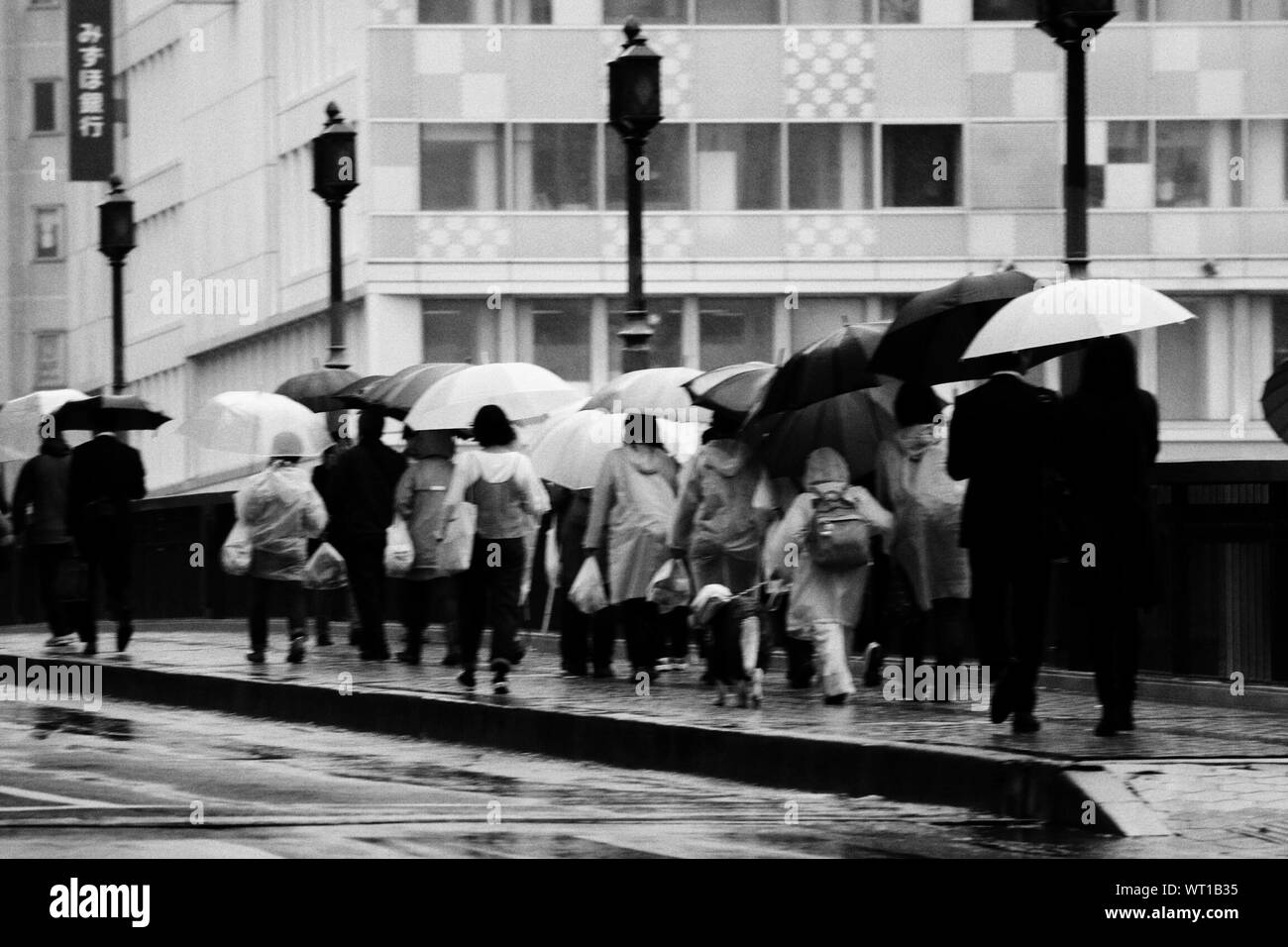 Rainy season umbrella crowd hires stock photography and images Alamy