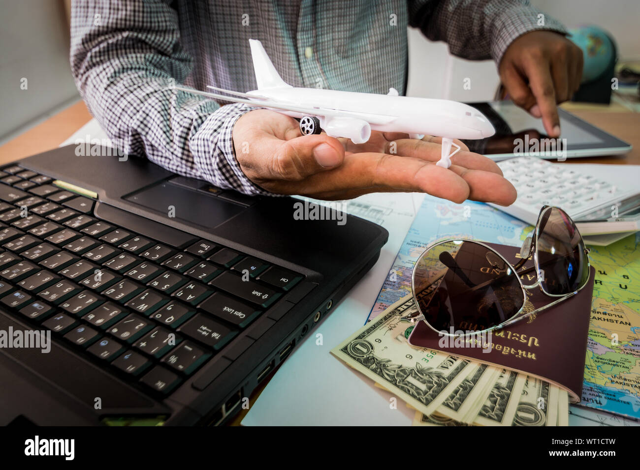 Planning vacation laptop map hi-res stock photography and images - Alamy