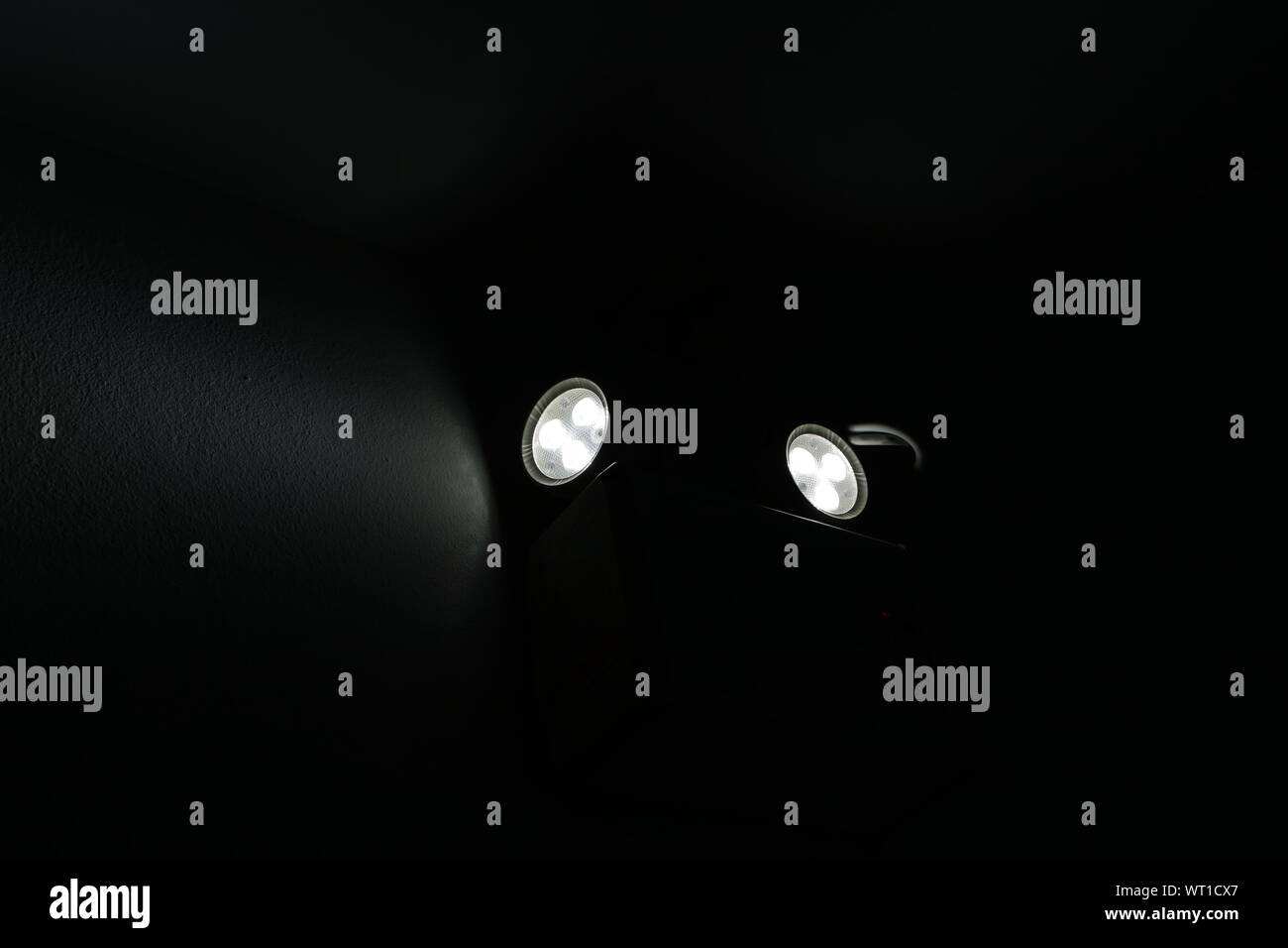 Emergency light installed on the wall of a building in operation during