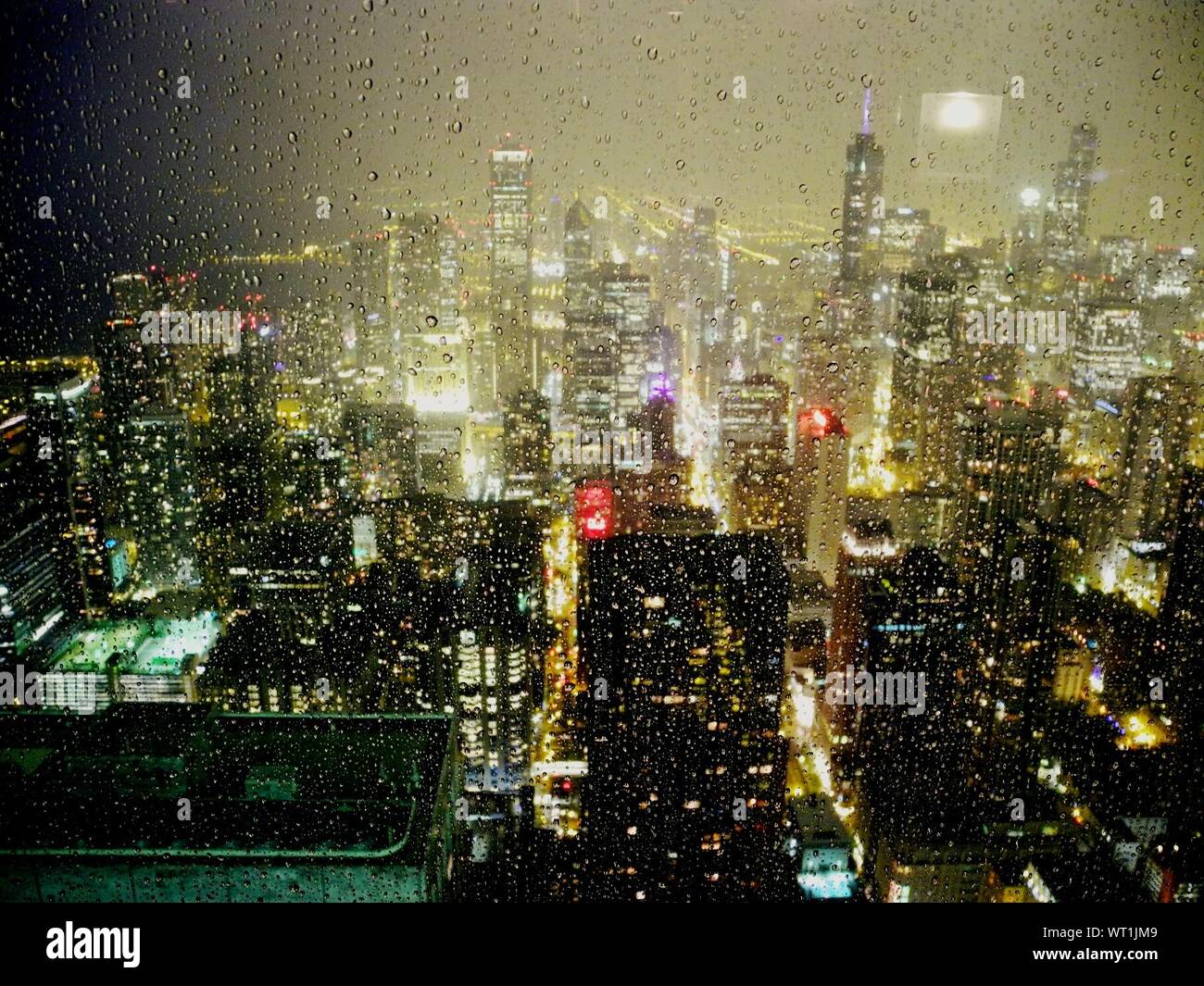 City through rainy window at night hi-res stock photography and images ...