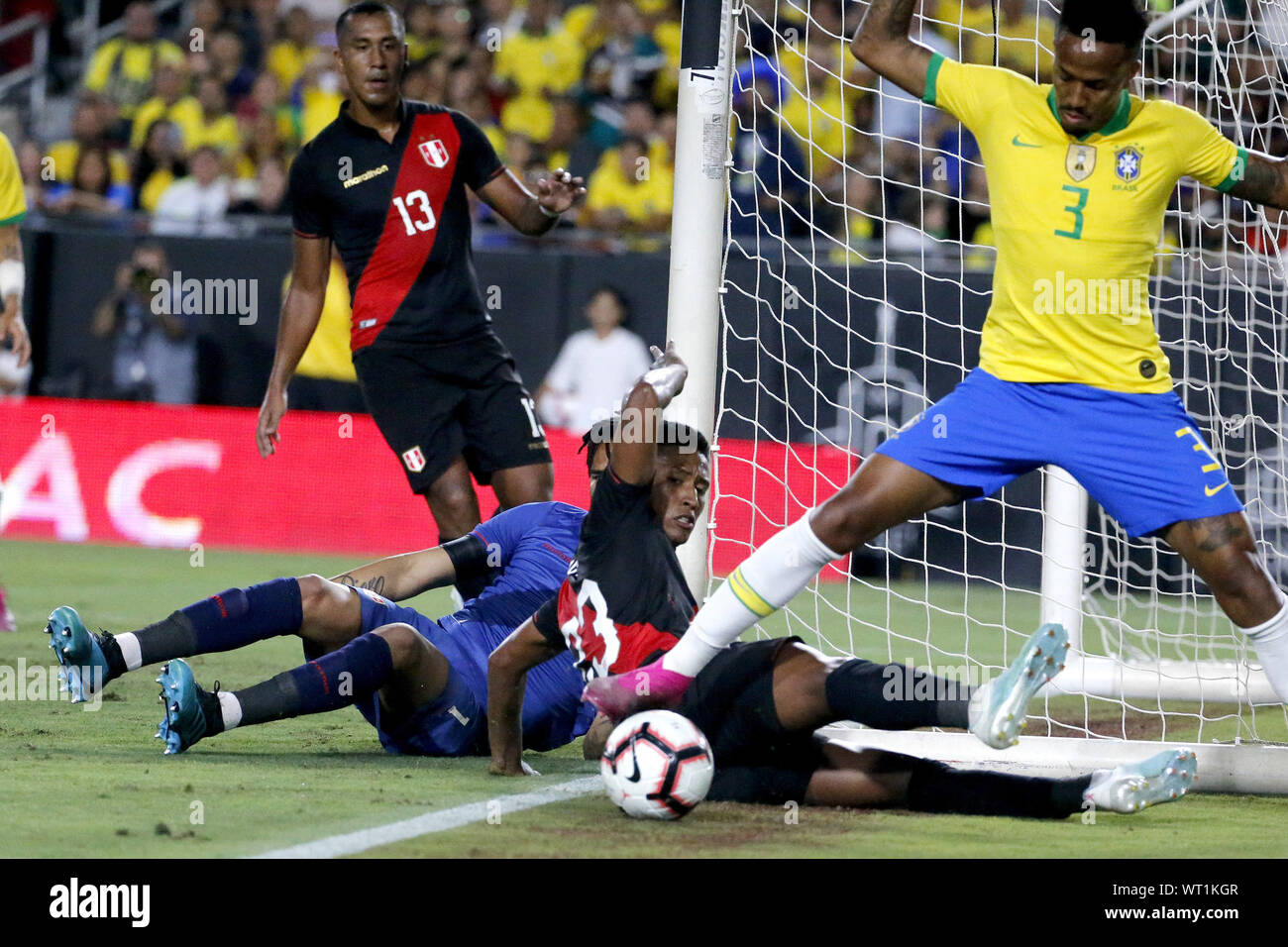 Los Angeles, California, USA. 10th Sep, 2019. Peru goalkeeper Pedro Gallese (1) and Peru midfielder Pedro Aquino (23) make save against Brazil defender Eder Militao (3) during an International Friendly Soccer match between Brazil and Peru at the Los Angeles Memorial Coliseum in Los Angeles on Tuesday, September 10, 2019. Credit: Ringo Chiu/ZUMA Wire/Alamy Live News Stock Photo