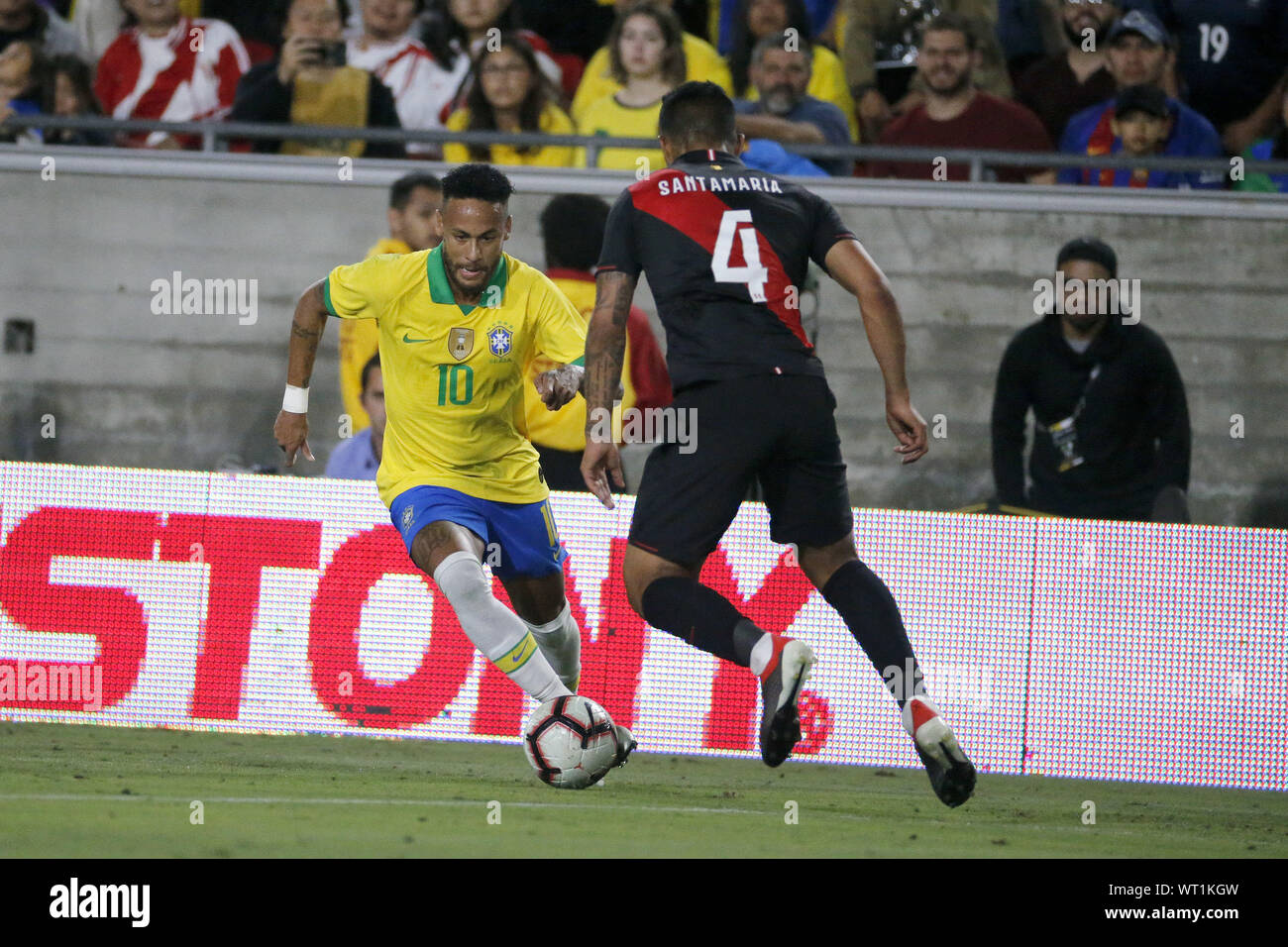 Los Angeles, California, USA. 10th Sep, 2019. Brazil forward Neymar Jr. (10) drives against Peru defender Anderson Santamaria (4) during an International Friendly Soccer match between Brazil and Peru at the Los Angeles Memorial Coliseum in Los Angeles on Tuesday, September 10, 2019. Credit: Ringo Chiu/ZUMA Wire/Alamy Live News Stock Photo