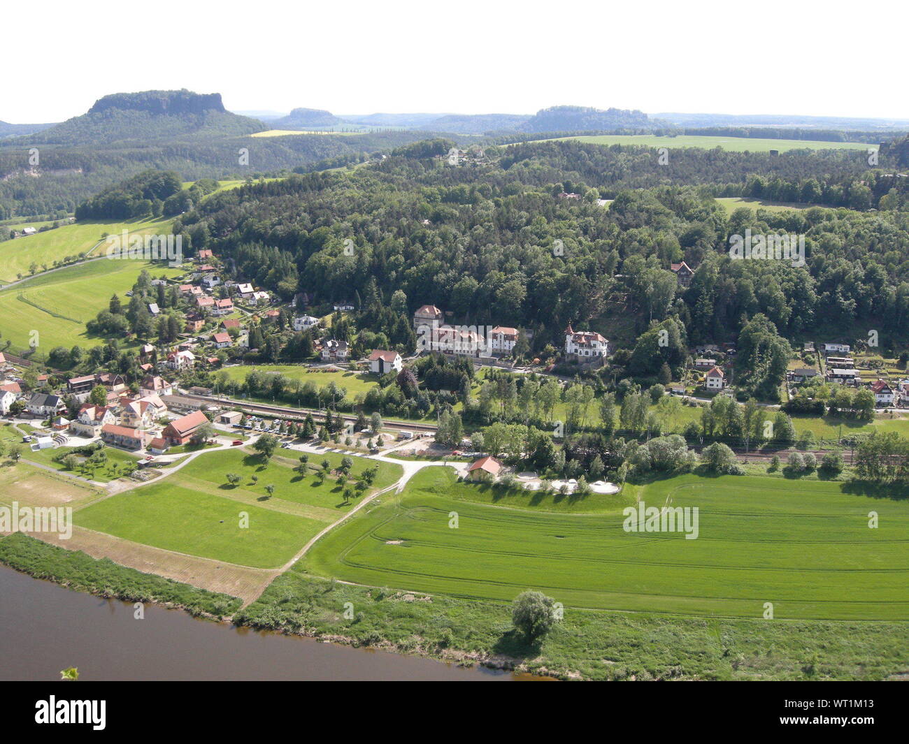 Ariel View Of River Fields And Cityscape Against Sky Stock Photo