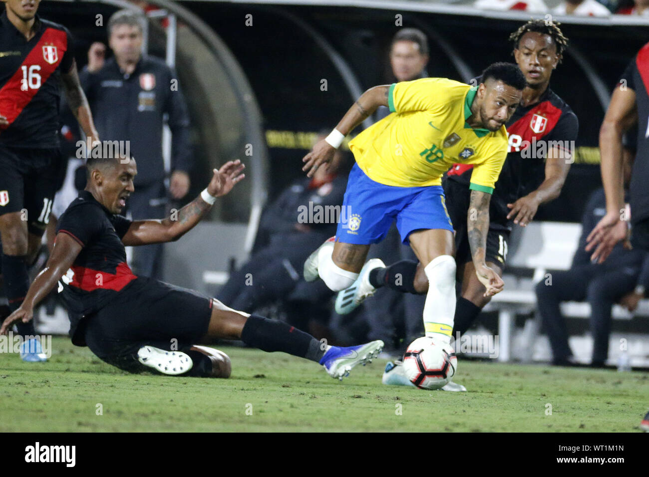 Los Angeles, California, USA. 10th Sep, 2019. Brazil forward Neymar Jr. (10) vies the ball past Peru midfielder Renato Tapia (13) during an International Friendly Soccer match between Brazil and Peru at the Los Angeles Memorial Coliseum in Los Angeles on Tuesday, September 10, 2019. Credit: Ringo Chiu/ZUMA Wire/Alamy Live News Stock Photo
