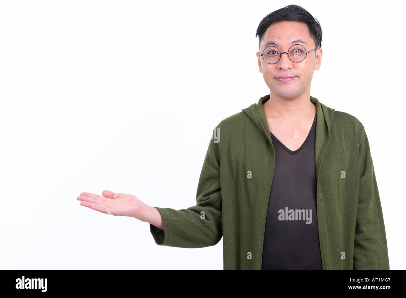 Portrait of Japanese man with eyeglasses showing something Stock Photo
