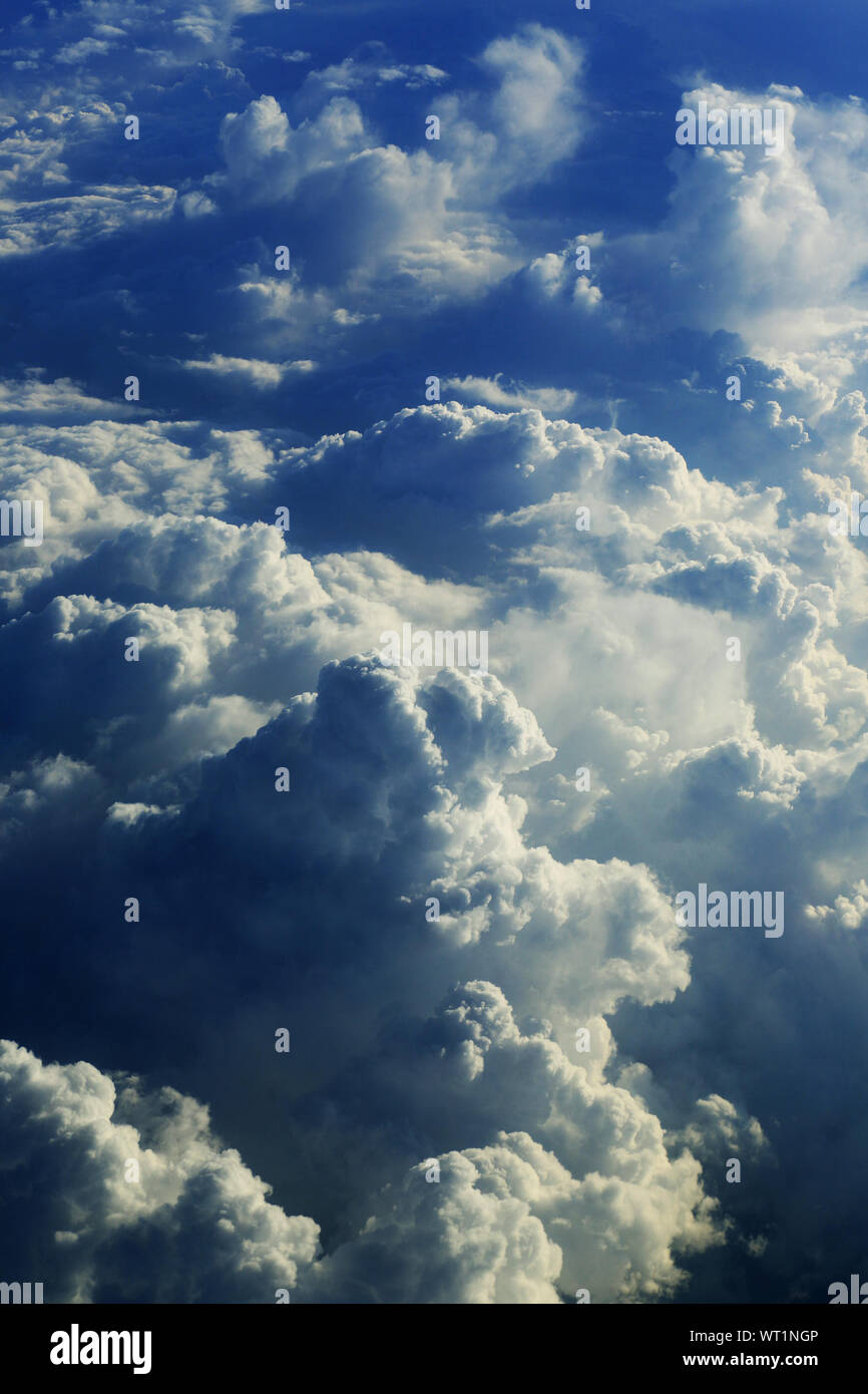 Low Angle View Of Fluffy Clouds In Sky Stock Photo