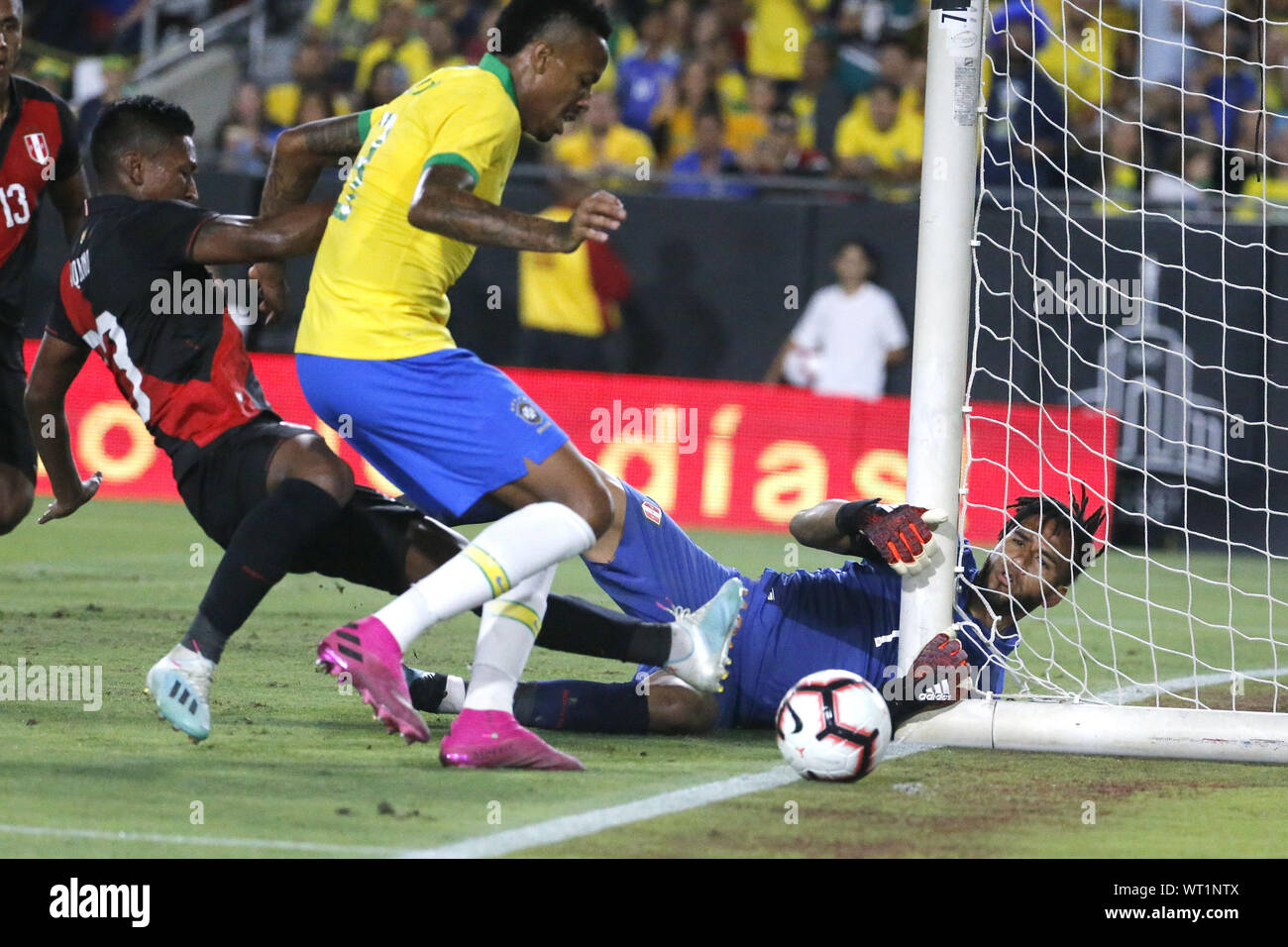 Los Angeles, California, USA. 10th Sep, 2019. Peru goalkeeper Pedro Gallese (1) and Peru midfielder Pedro Aquino (23) make save against Brazil defender Eder Militao (3) during an International Friendly Soccer match between Brazil and Peru at the Los Angeles Memorial Coliseum in Los Angeles on Tuesday, September 10, 2019. Credit: Ringo Chiu/ZUMA Wire/Alamy Live News Stock Photo