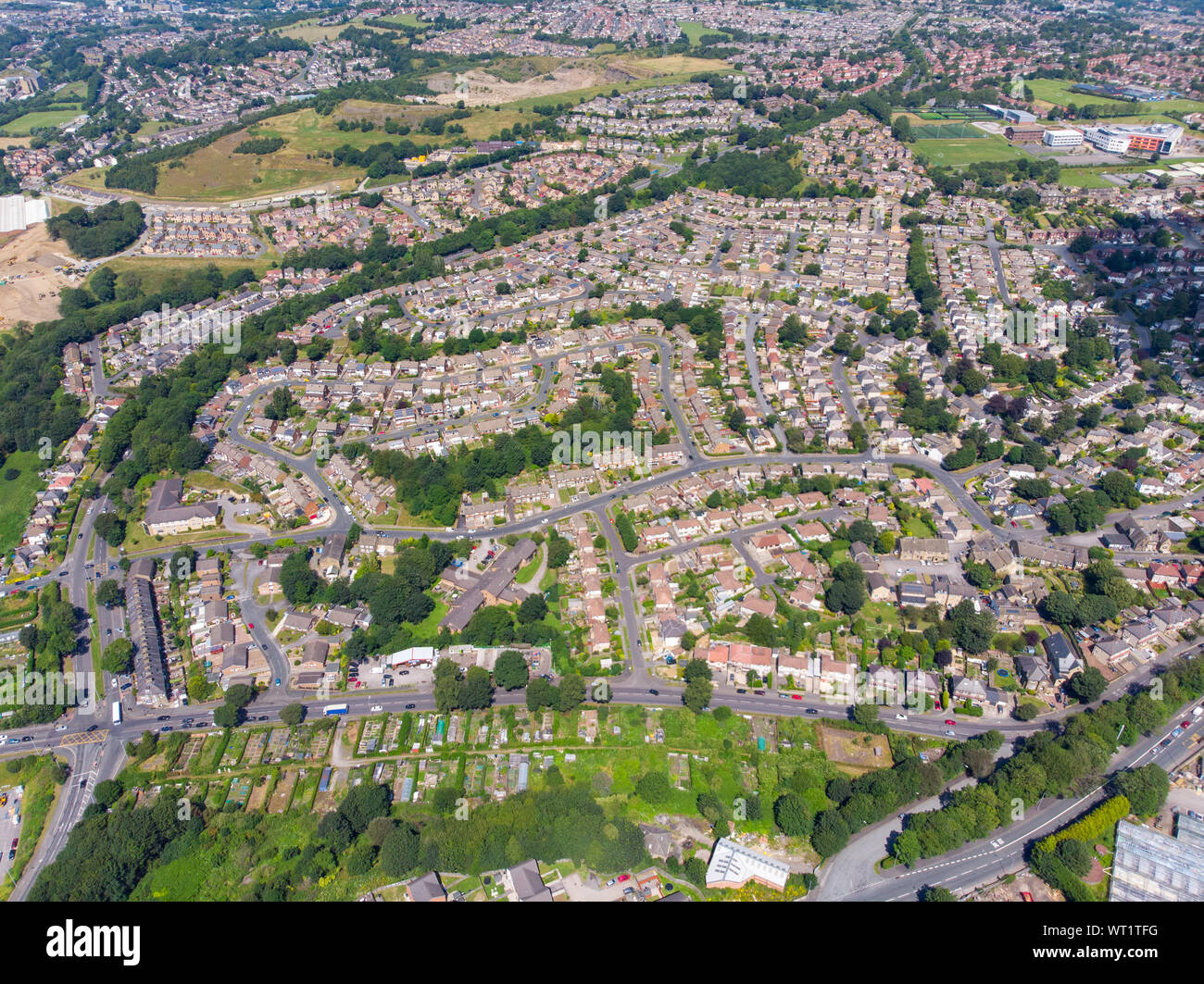 Aerial photo of the British West Yorkshire town of Bradford, showing a typical housing estate in the heart of the city, taken with a drone on a bright Stock Photo