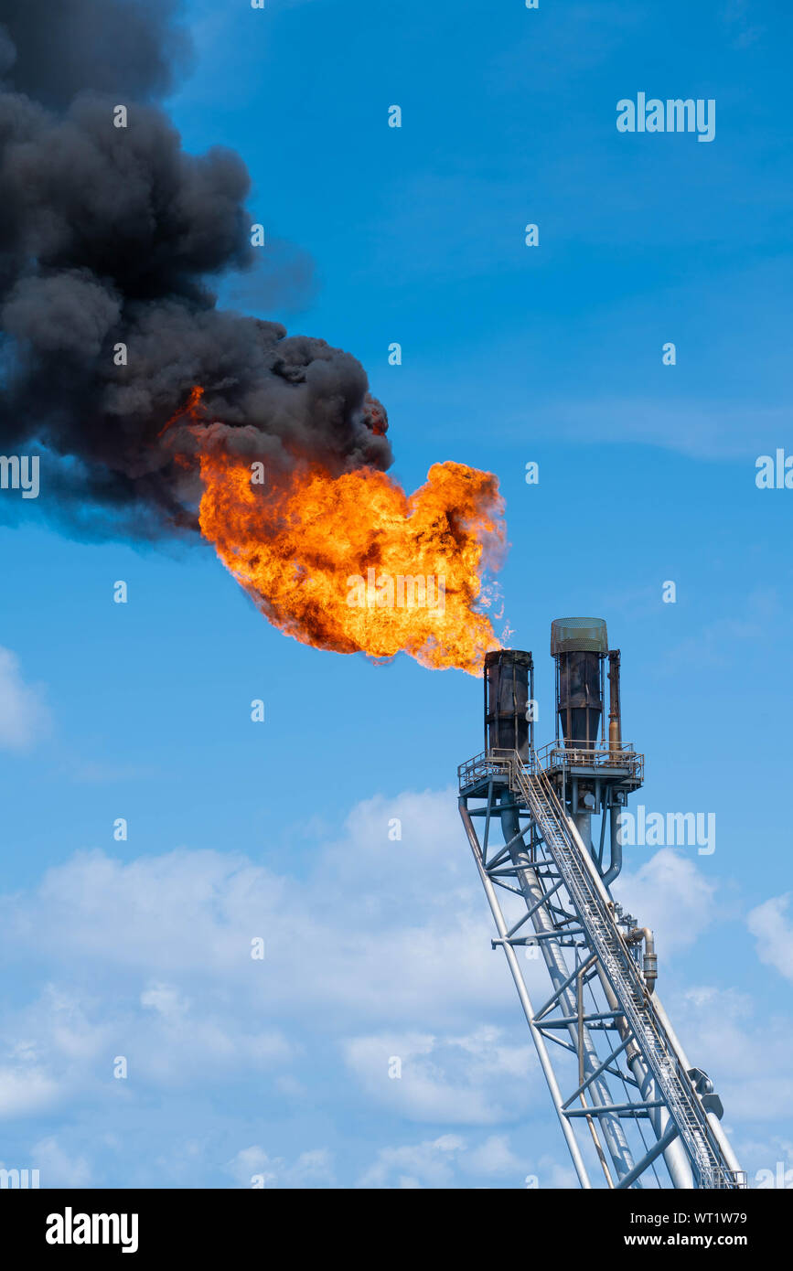 Flare tip of gas processing platform to vent and burn toxic, release gases to safe area. Stock Photo