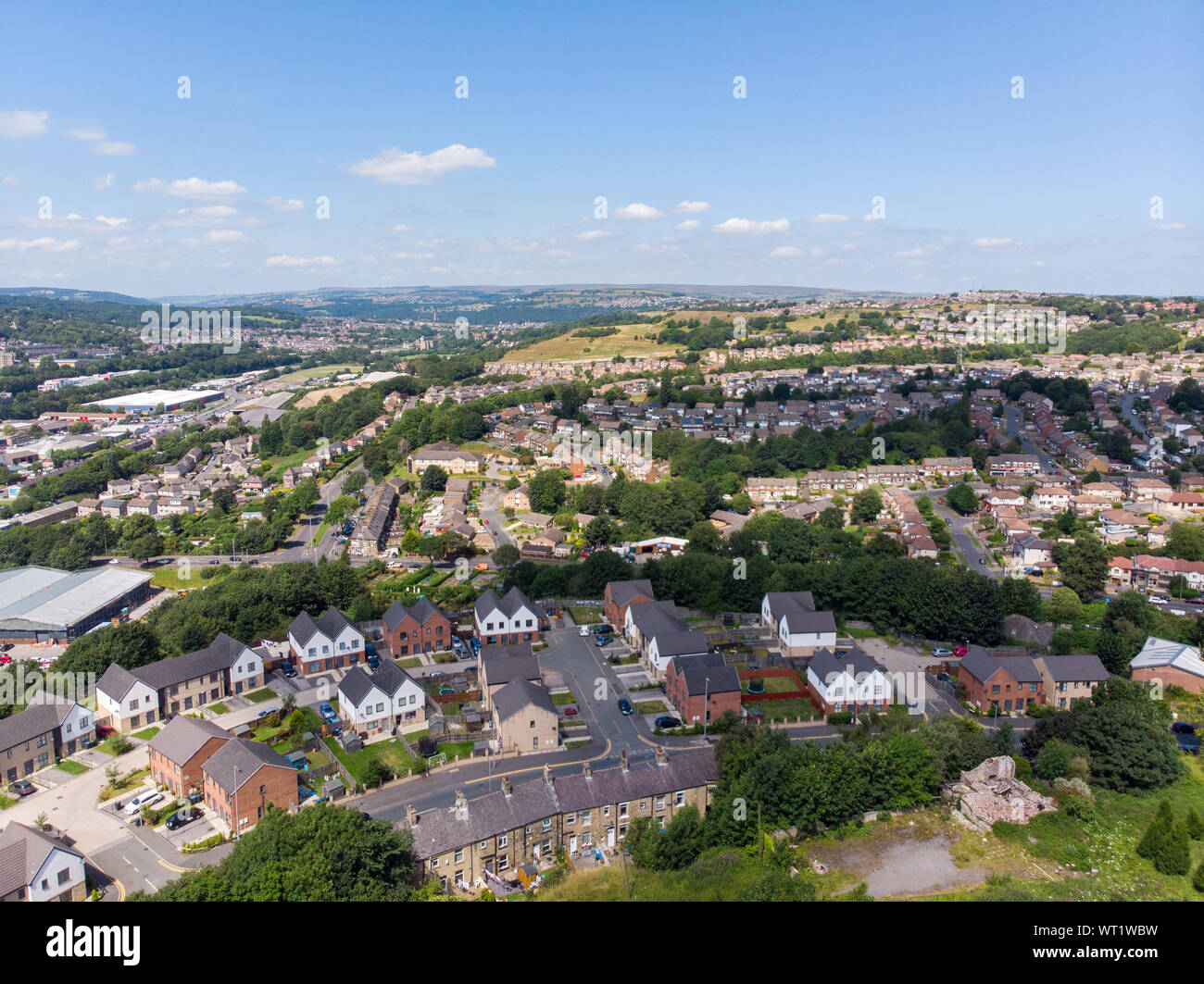 Aerial photo of the British West Yorkshire town of Bradford, showing a typical housing estate in the heart of the city, taken with a drone on a bright Stock Photo