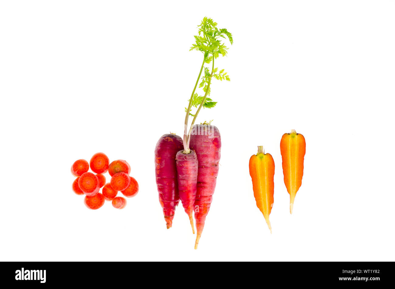 Pieces of colorful raw carrots on white background. Studio Photo Stock