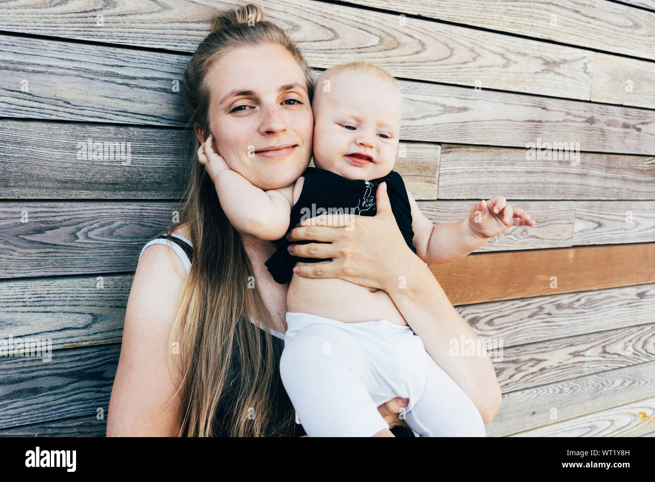 young mother hugs baby Stock Photo