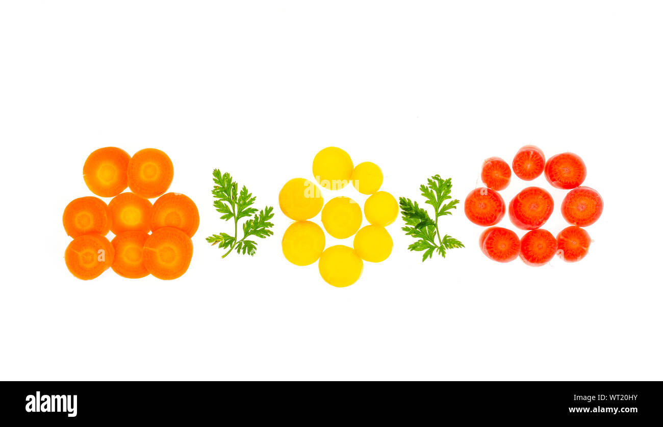 Pieces of colorful raw carrots on white background. Studio Photo Stock Photo