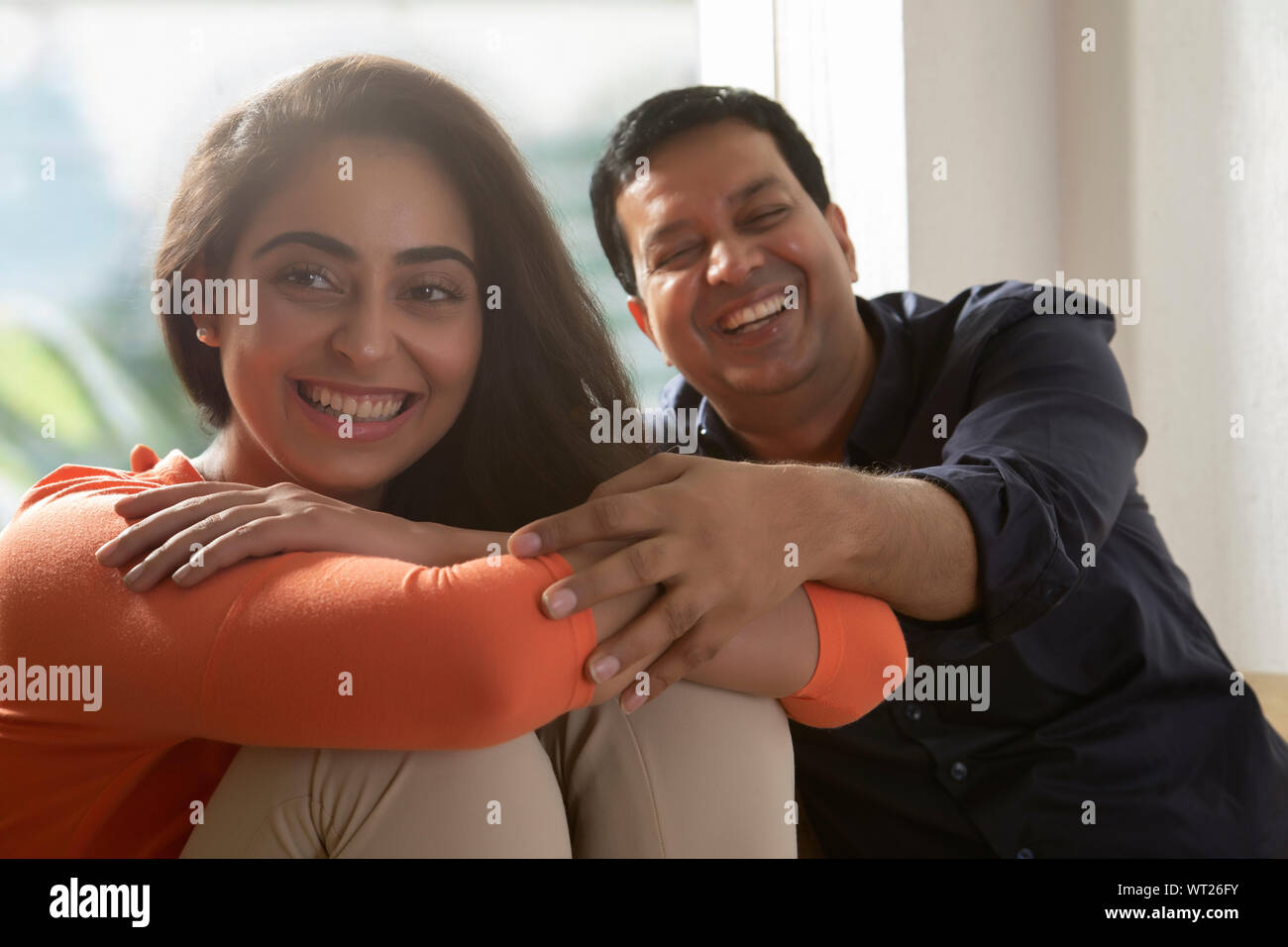 husband and wife having a quality time at home Stock Photo