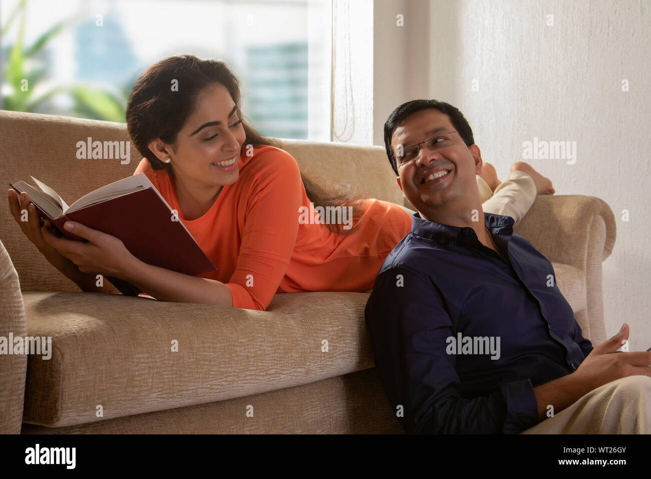 husband and wife having a quality time at home Stock Photo