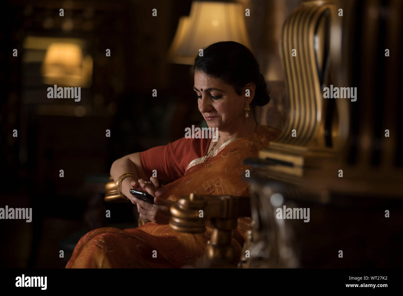 portrait of a woman looking at her phone Stock Photo