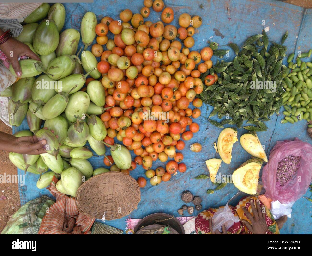 Cropped Image Of Vendor And Buyer By Vegetables At Market Stock Photo
