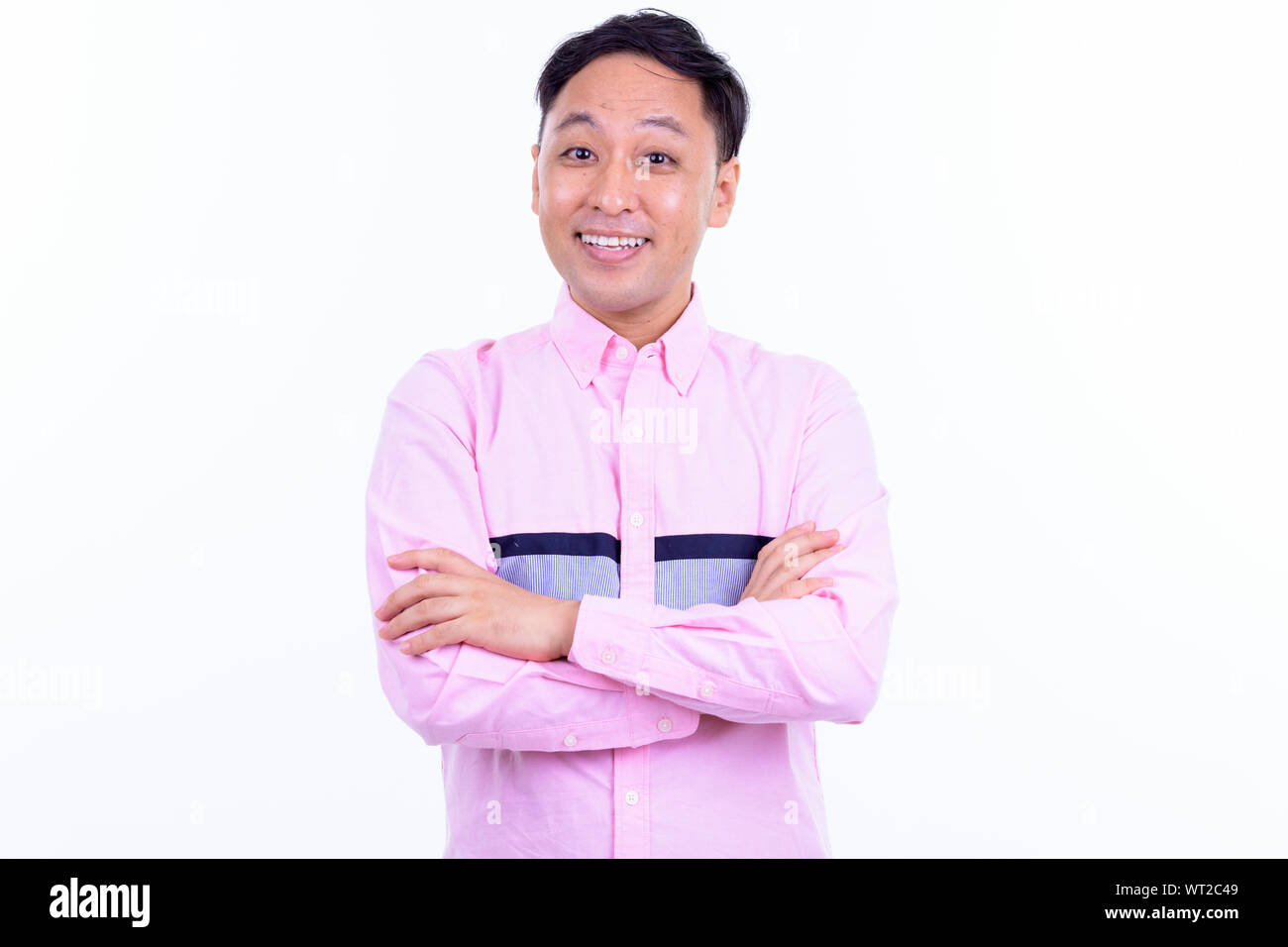 Portrait of happy Japanese businessman smiling with arms crossed Stock ...