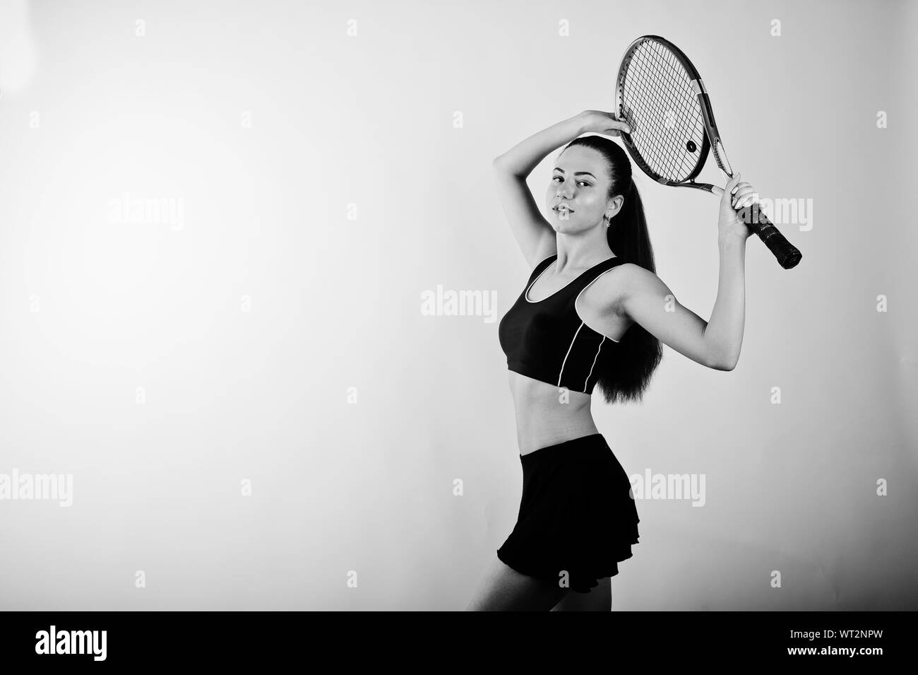 Black and white portrait of beautiful young woman player in sports ...