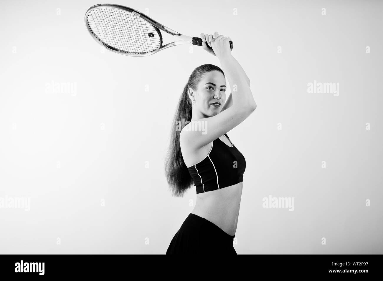 Black and white portrait of beautiful young woman player in sports ...