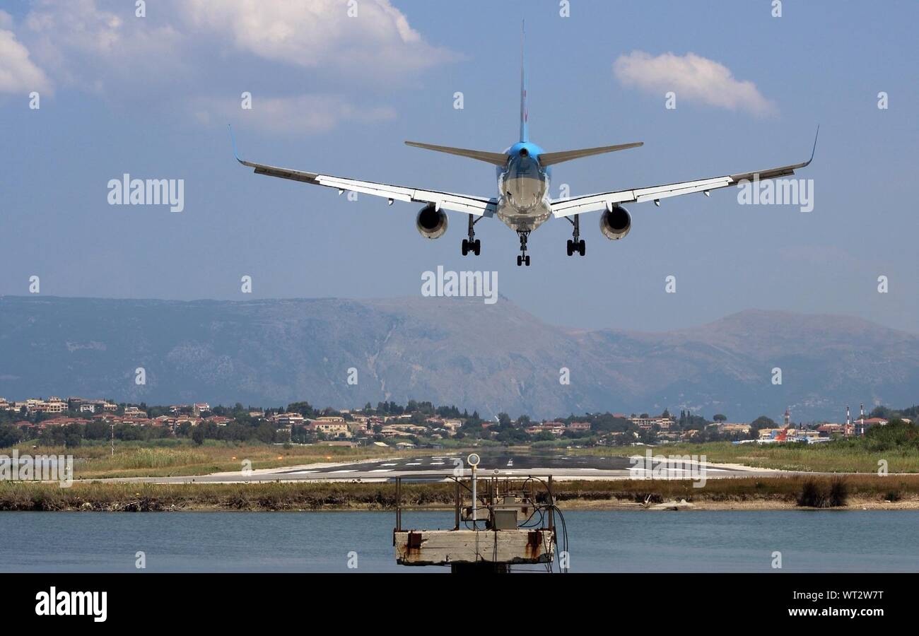 Aircraft Landing On Runway Stock Photo