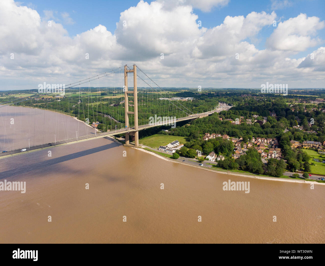 Wide photo of The Humber Bridge, near Kingston upon Hull, East Riding of Yorkshire, England, single-span road suspension bridge, taken on a sunny day Stock Photo