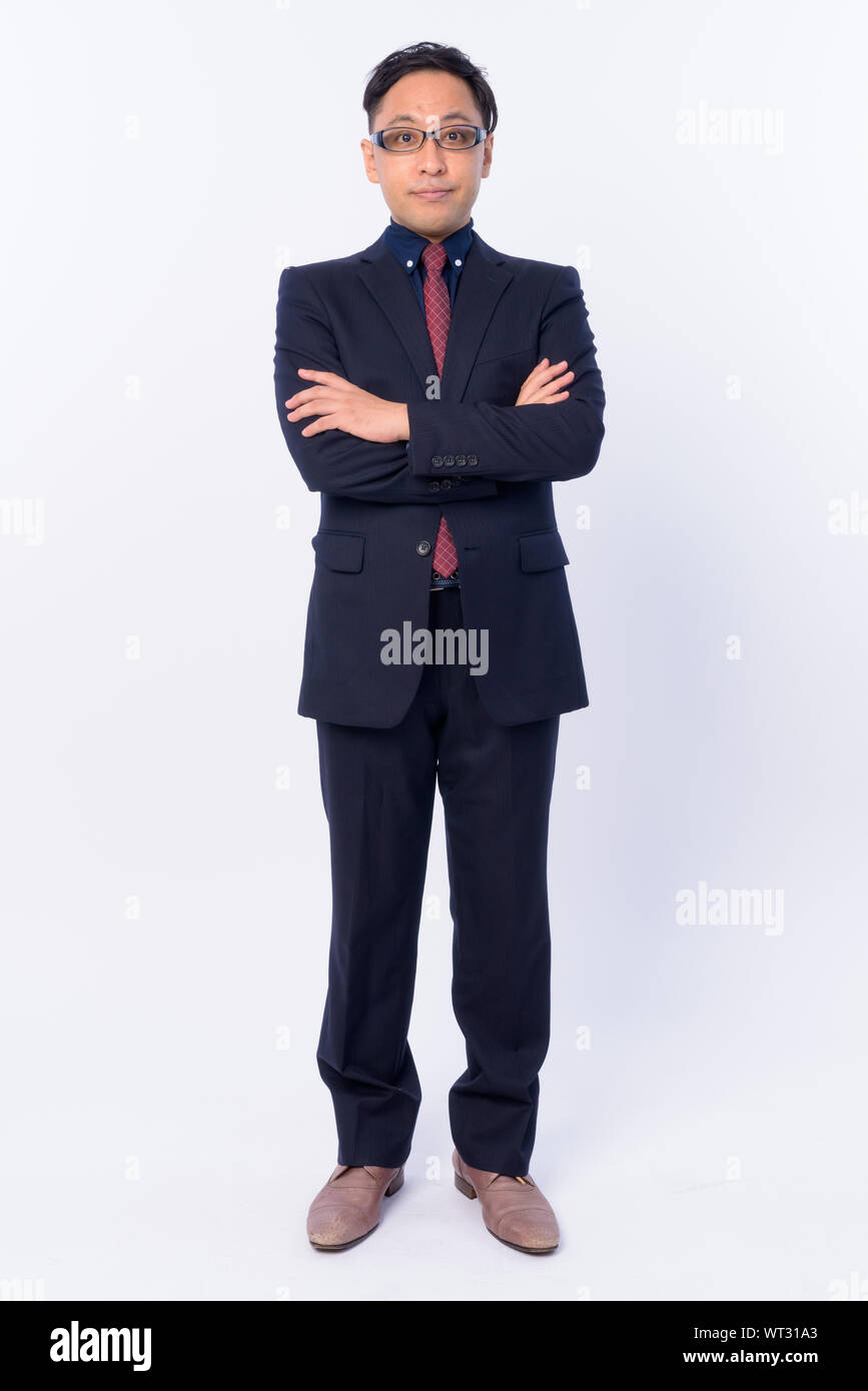 Full body shot of Japanese businessman in suit with arms crossed Stock ...