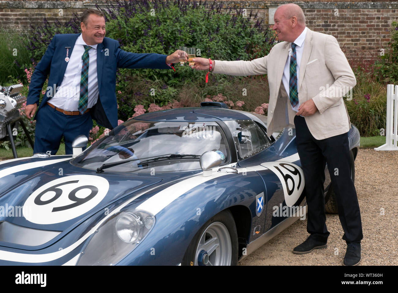 Howard Guy CEO of Design Q  and Neville Swales with the Ecuire Ecosse LM69 at cars launch at Hampton Court 2019 Stock Photo