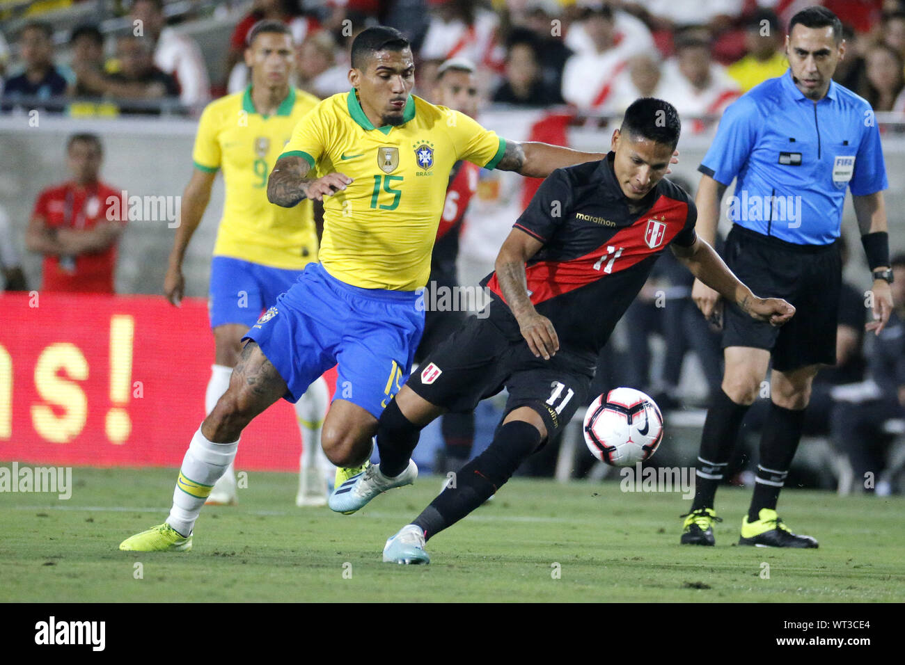 Los Angeles, California, USA. 11th Sep, 2019. Peru forward Raul Ruidiaz (11) and Brazil midfielder Allan (15) vie for the ball during an International Friendly Soccer match between Brazil and Peru at the Los Angeles Memorial Coliseum in Los Angeles on Tuesday, September 10, 2019. Credit: Ringo Chiu/ZUMA Wire/Alamy Live News Stock Photo