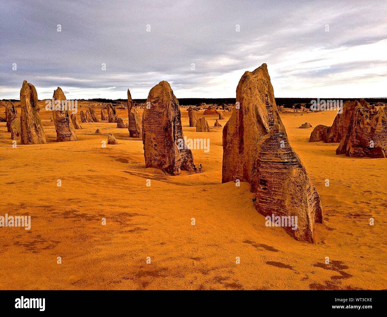 The Pinnacles Desert Against Sky Stock Photo