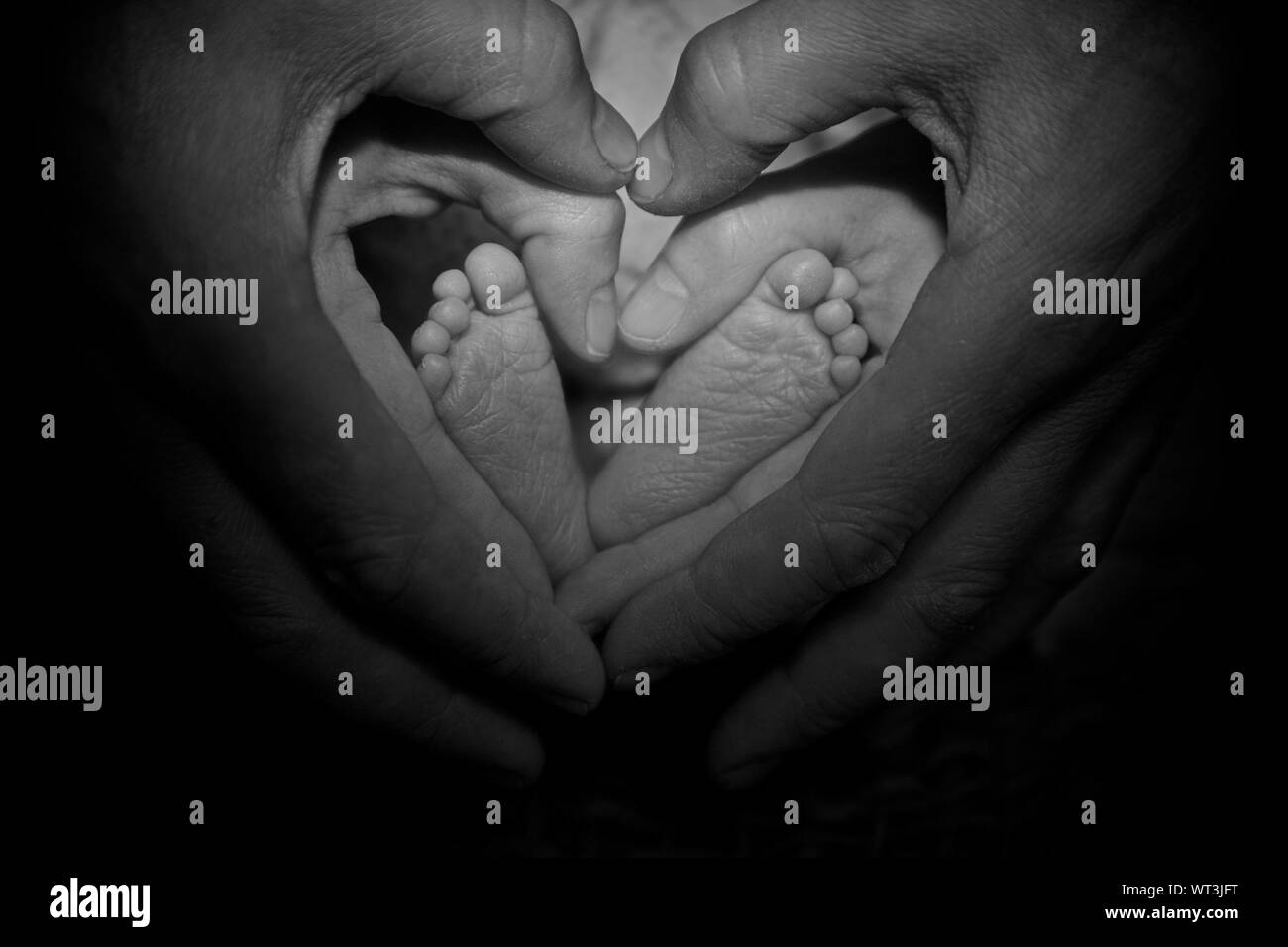 Boy touching legs Black and White Stock Photos & Images Alamy