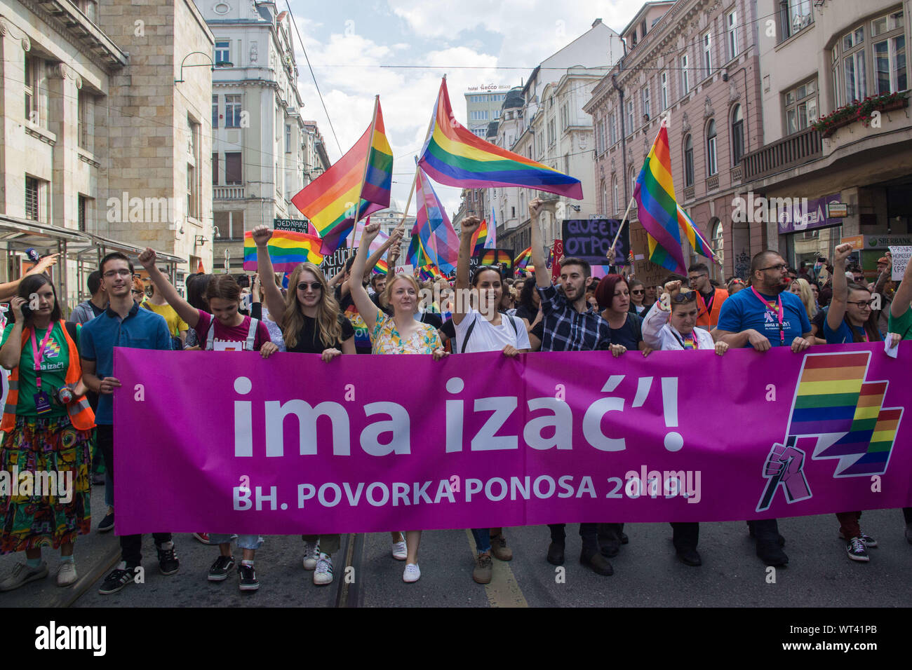 September 8, 2019, Sarajevo, Bosnia and Herzegovina: Protesters march with a huge banner and rainbow flags during the pride parade..''Ima Izac!'' translated as ''Open the door, please'' was the motto of the first Bosnian LGBTIQ pride parade, It's a request for more freedom in a country still endangered by religious radicalism. The parade represented an historical moment in Bosnian history. (Credit Image: © Pierpaolo Totti/SOPA Images via ZUMA Wire) Stock Photo