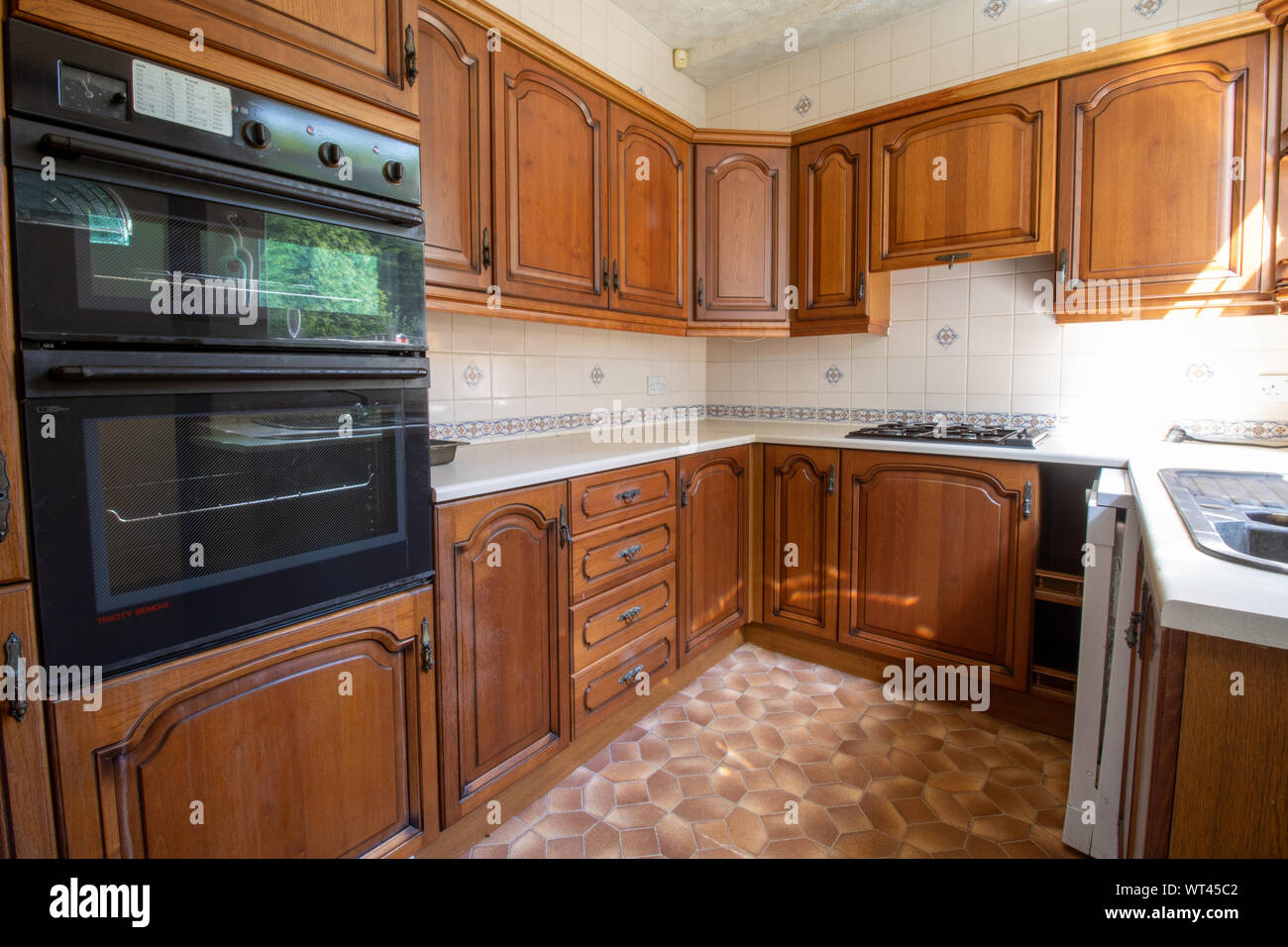 An Old 80 S Style Interior Kitchen Showing A Classic Brown