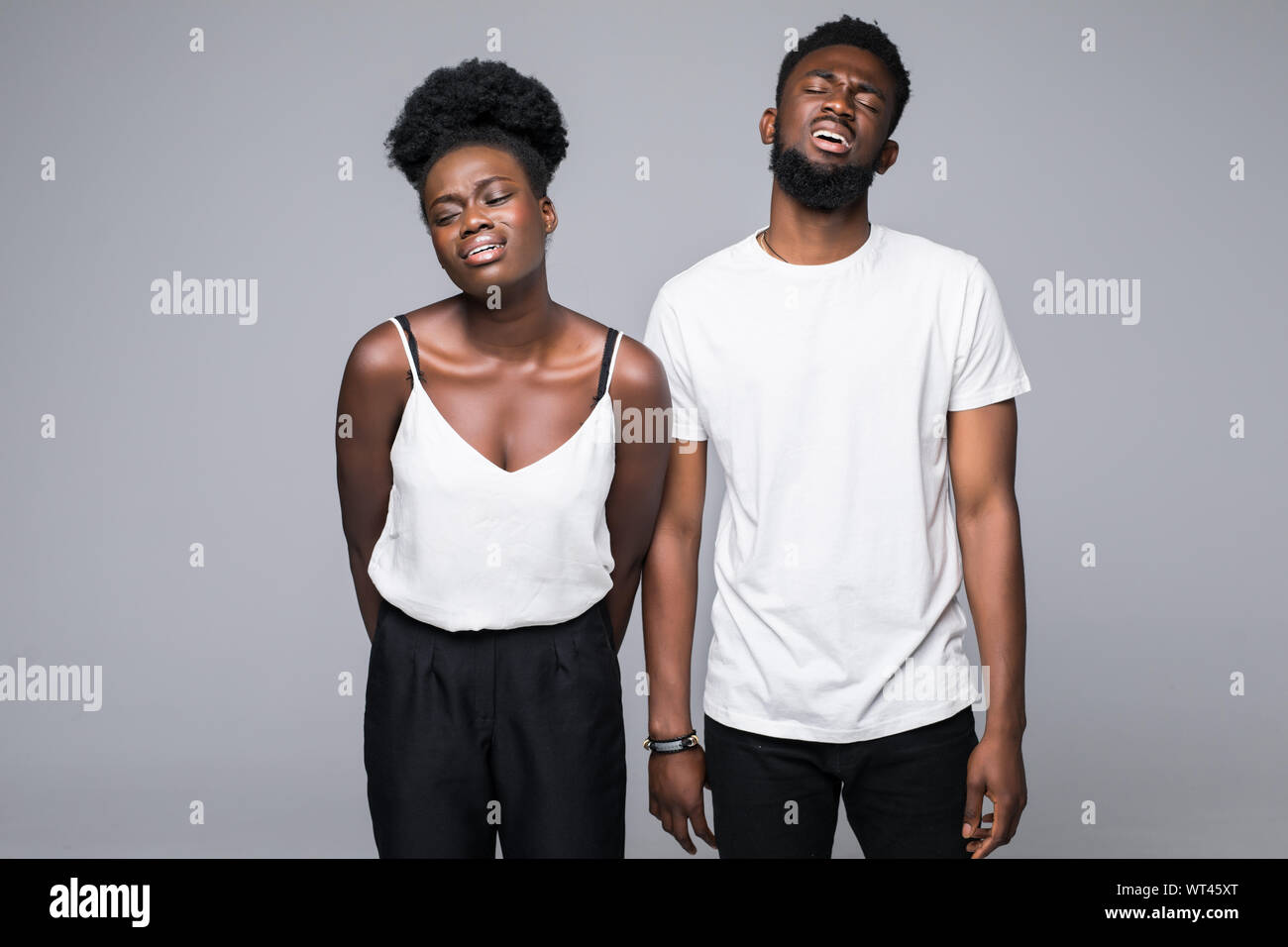 Young african couple standing isolated on gray background Stock Photo ...