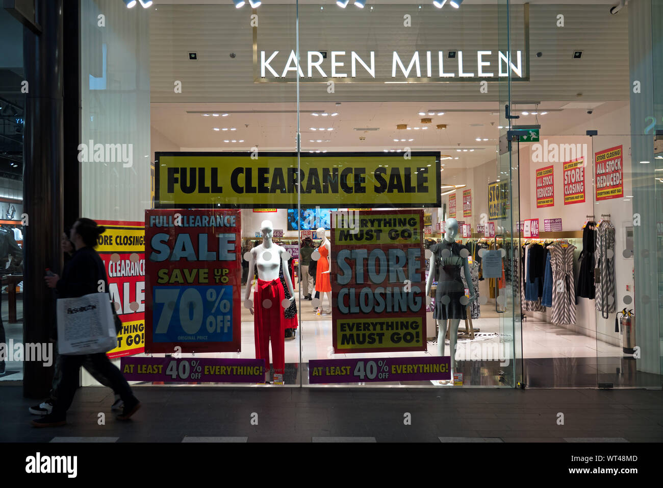 store closing and everything must go sale signs in the window of british womens clothing retailer karen millen in liverpool one shopping centre WT48MD