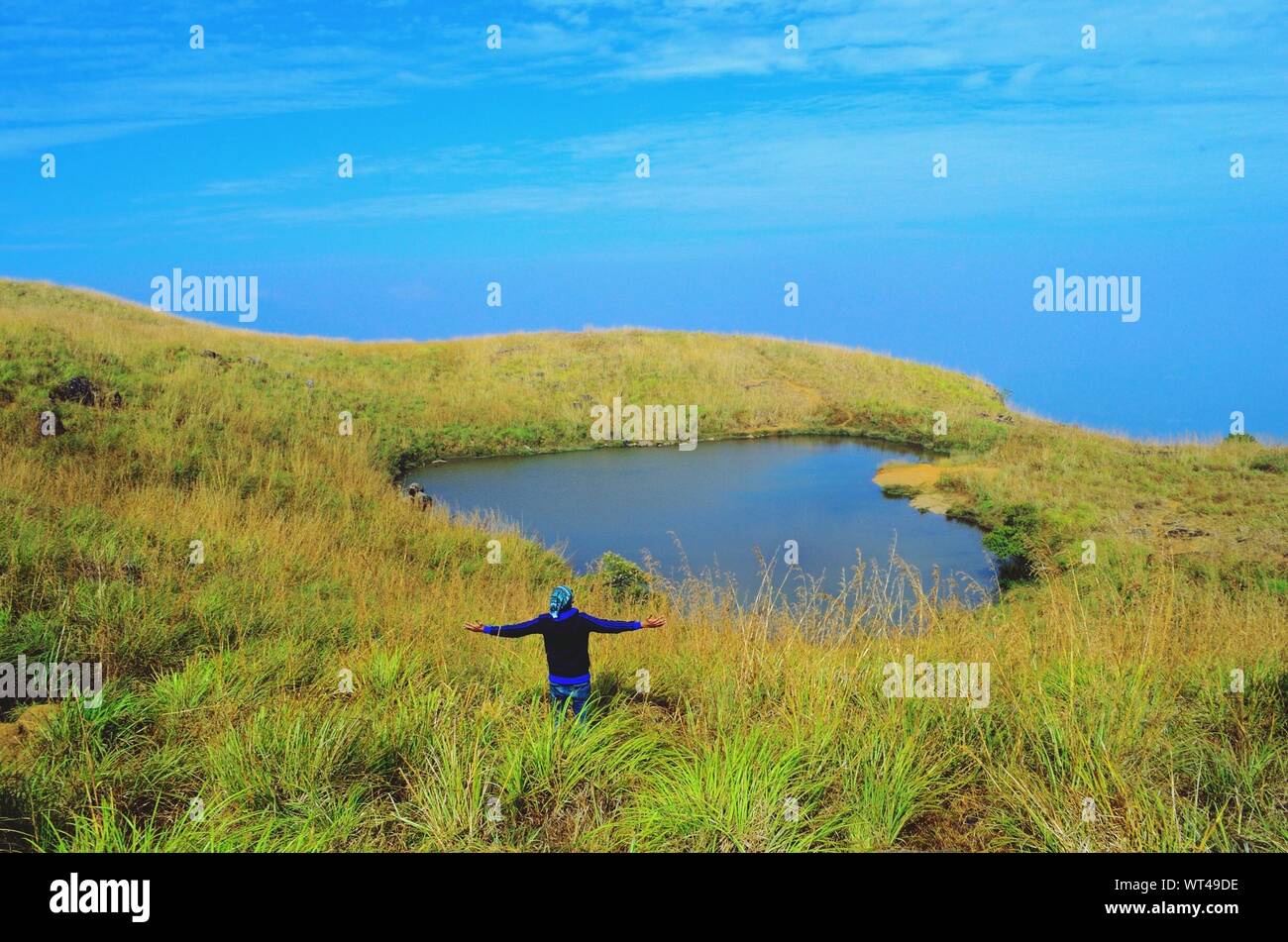 Man With Outstretched Arms Stock Photo