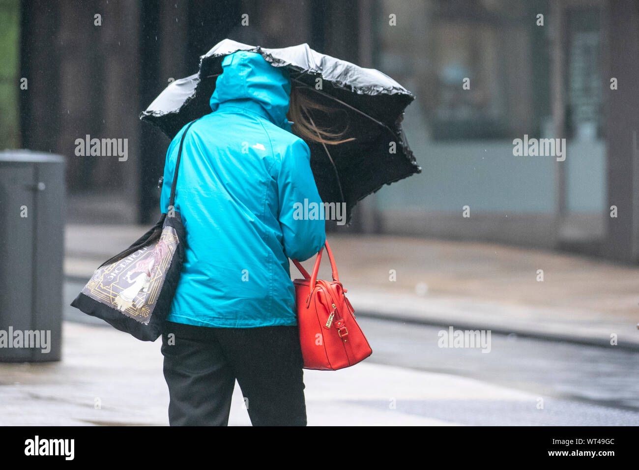 Rainy day in Preston, Lancashire.  September, 2019. UK Weather: Blustry start to the day with heavy showers in the city centre, and shoppers and commuters head for the retail sector as the remains of Tropical Storm Gabrielle arrive to the UK and this and this will bring further outbreaks of rain across western parts of the country. Credit: MediaWorldImages/Alamy Live News Stock Photo