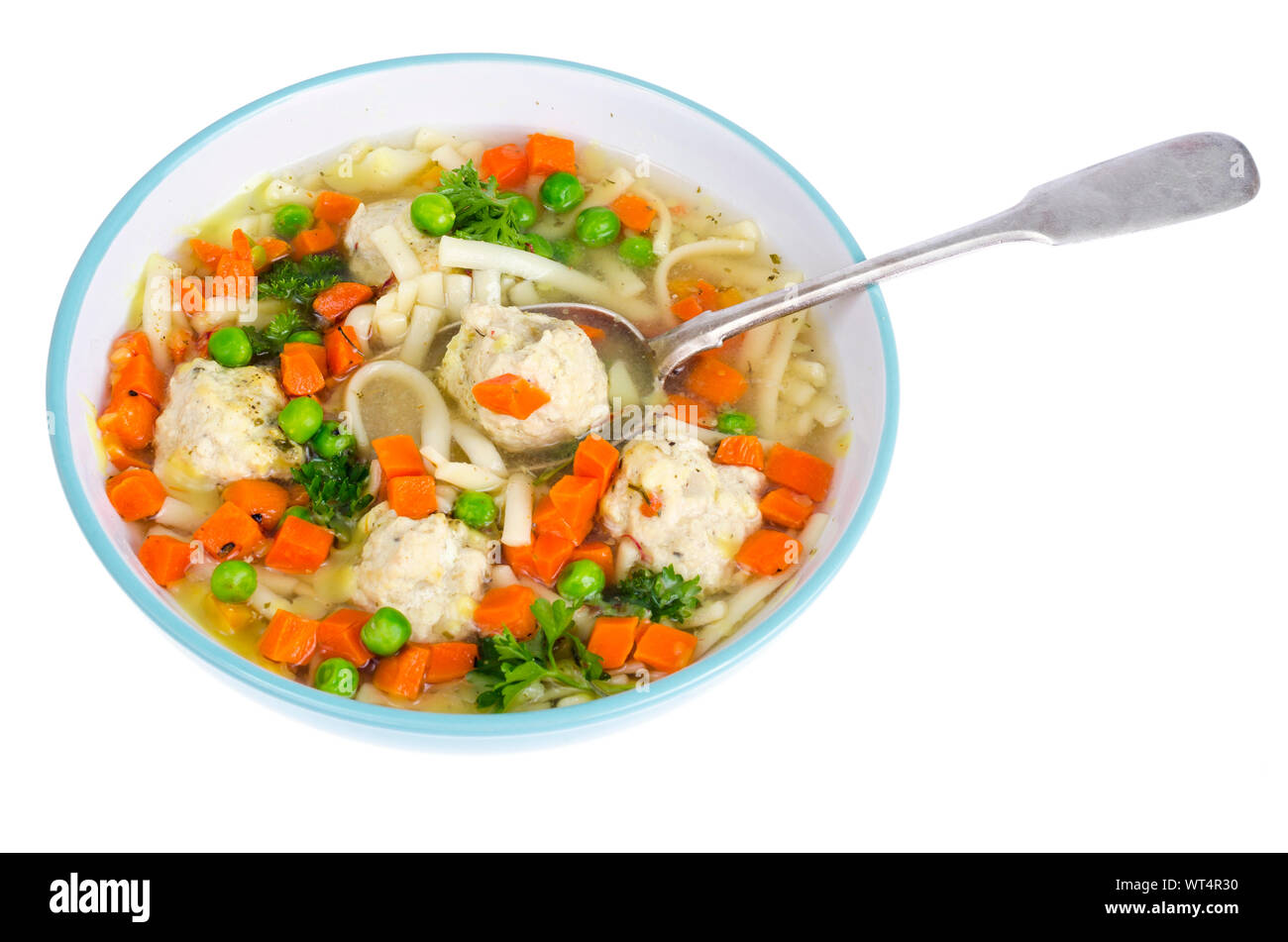 Chicken broth with vegetables, pasta and meatballs. Studio Photo Stock Photo