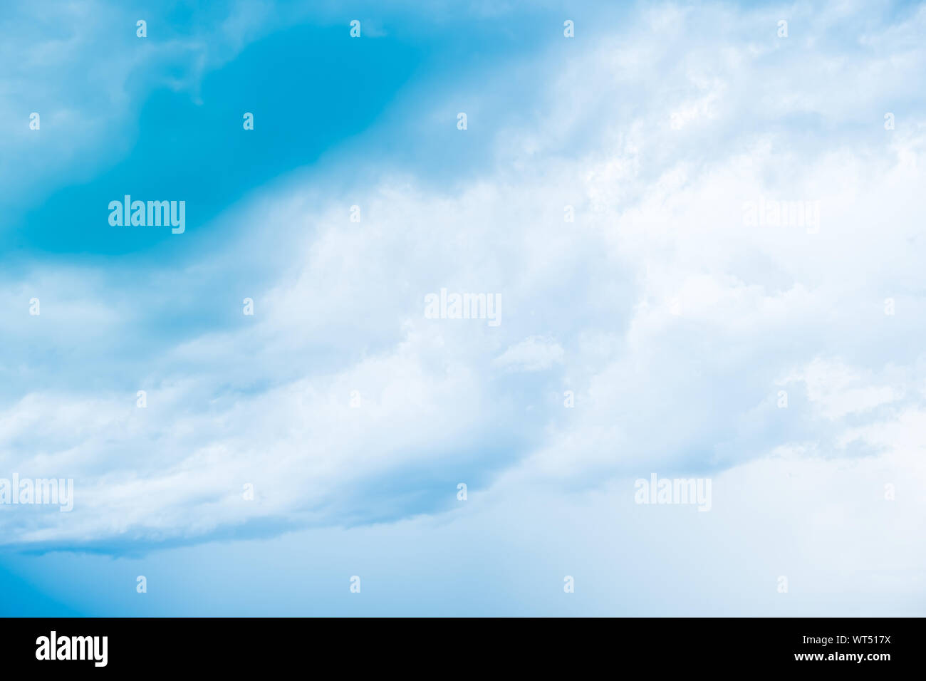 White clouds in blue sky, abstract blurred background Stock Photo - Alamy