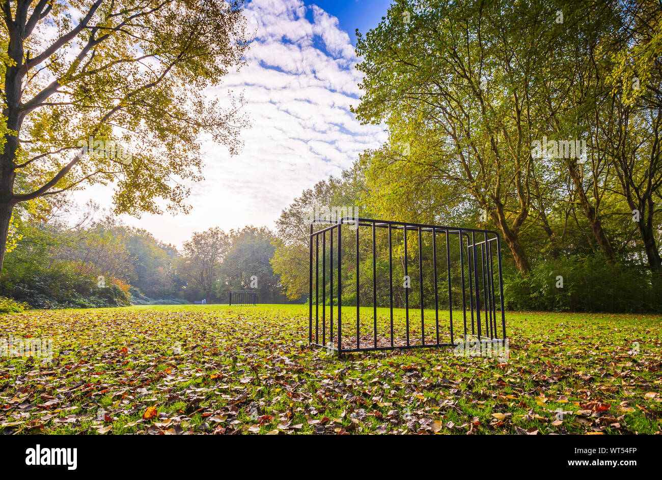 Abandoned soccer goal play ground, grass field on a beautiful Autumn day. Nice sunlight and vibrant colors. HDR, High dynamic range, Stock Photo