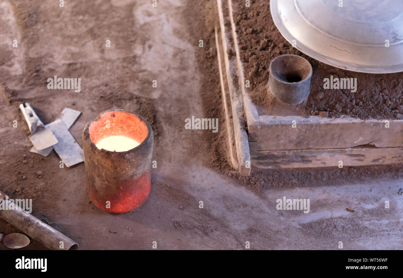 Manufacturing of aluminum kitchen utensils, working with salvaged materials, selective focus Stock Photo