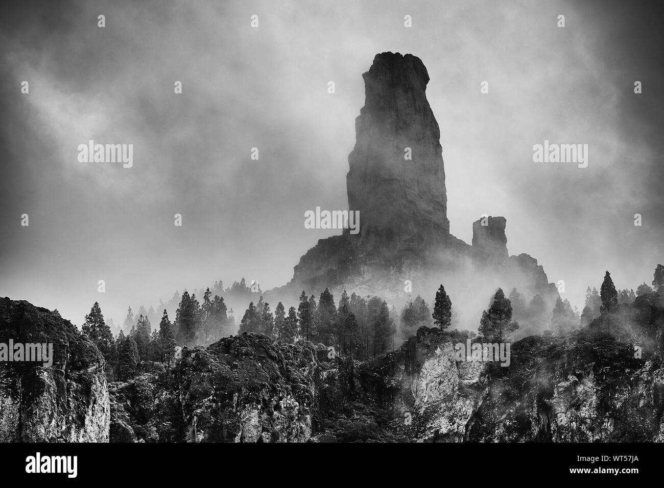 Scenic View Of Rock Formation Against Sky During Foggy Weather At Pilancones Stock Photo