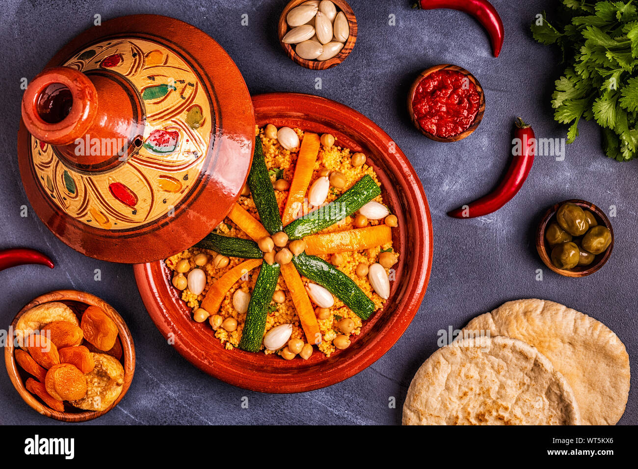 Vegetable tagine with almond and chickpea couscous, top view Stock