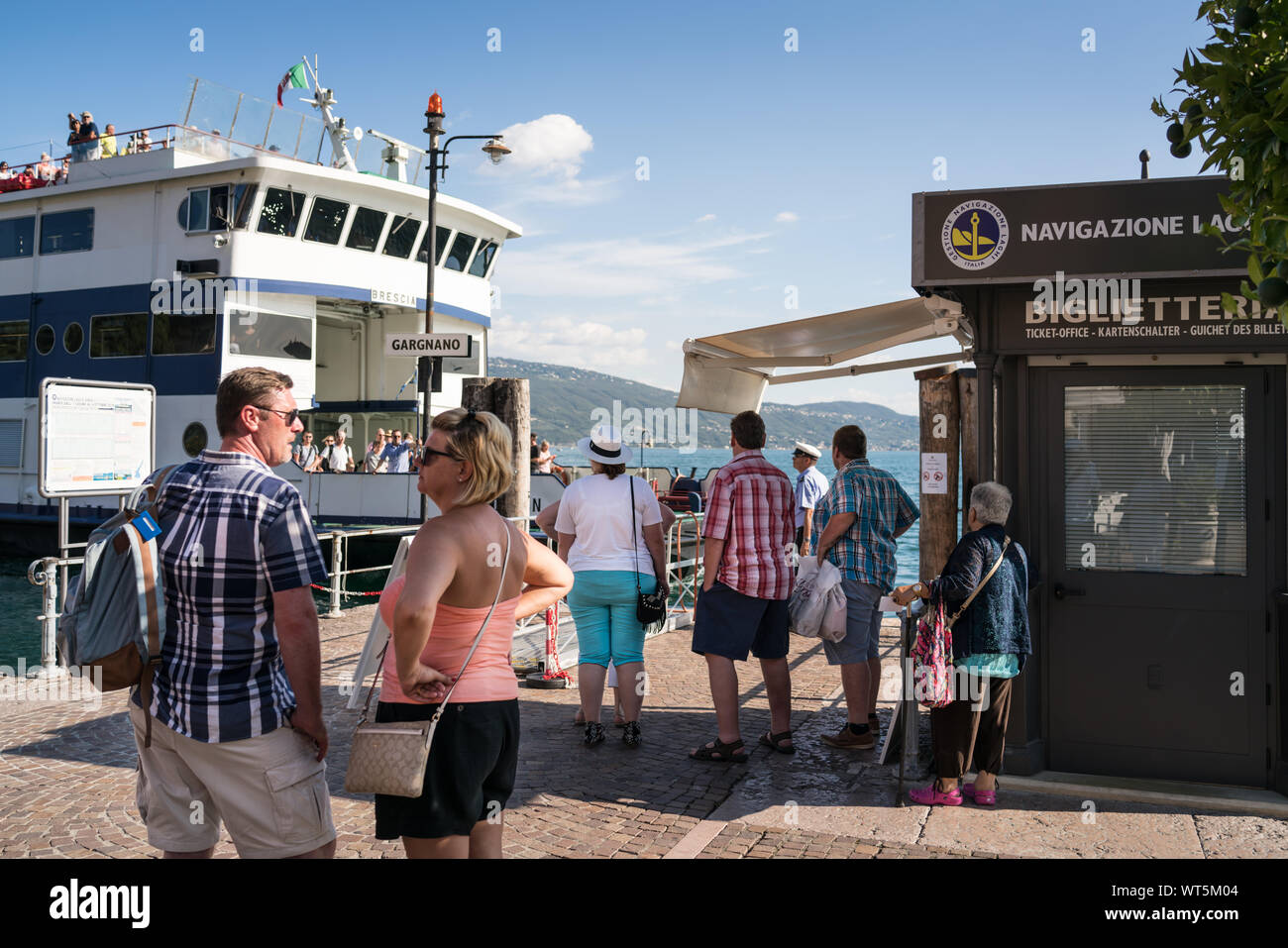 People waiting for the ferry Lake Garda Italy Stock Photo