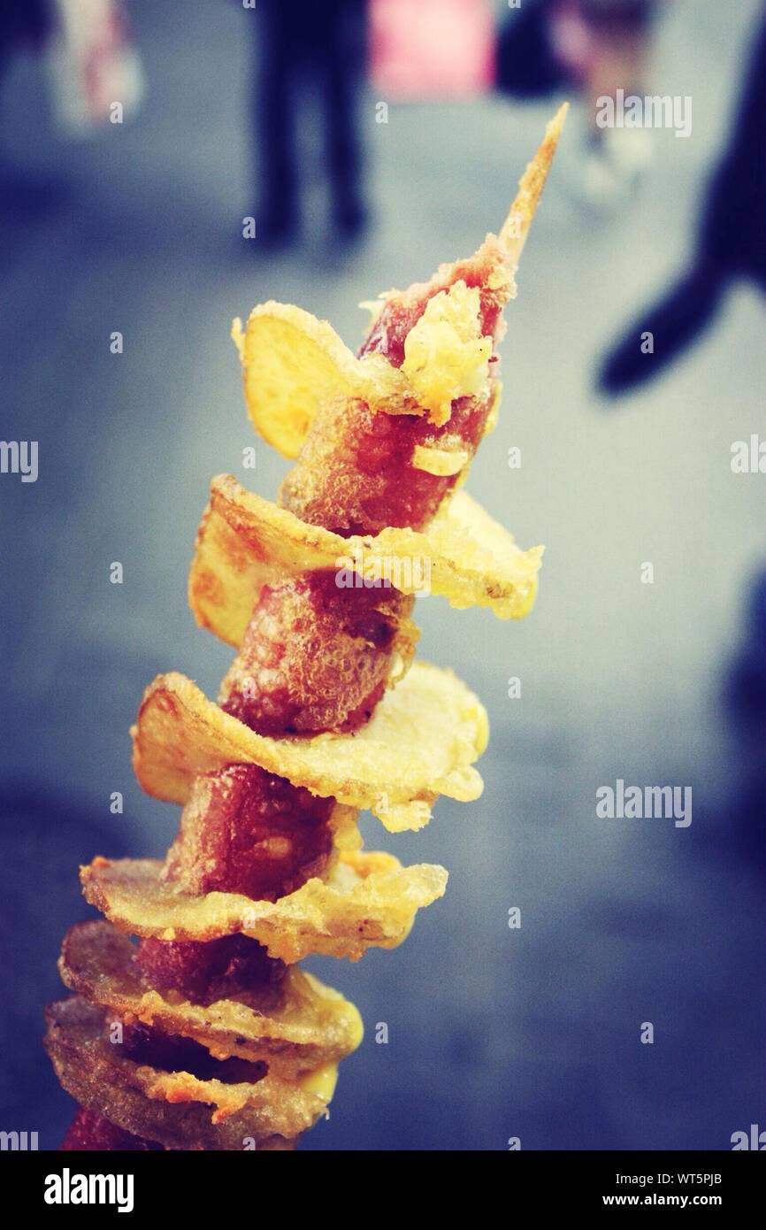 Deep Fried Sausage With Potato Chips On Skewer Stock Photo