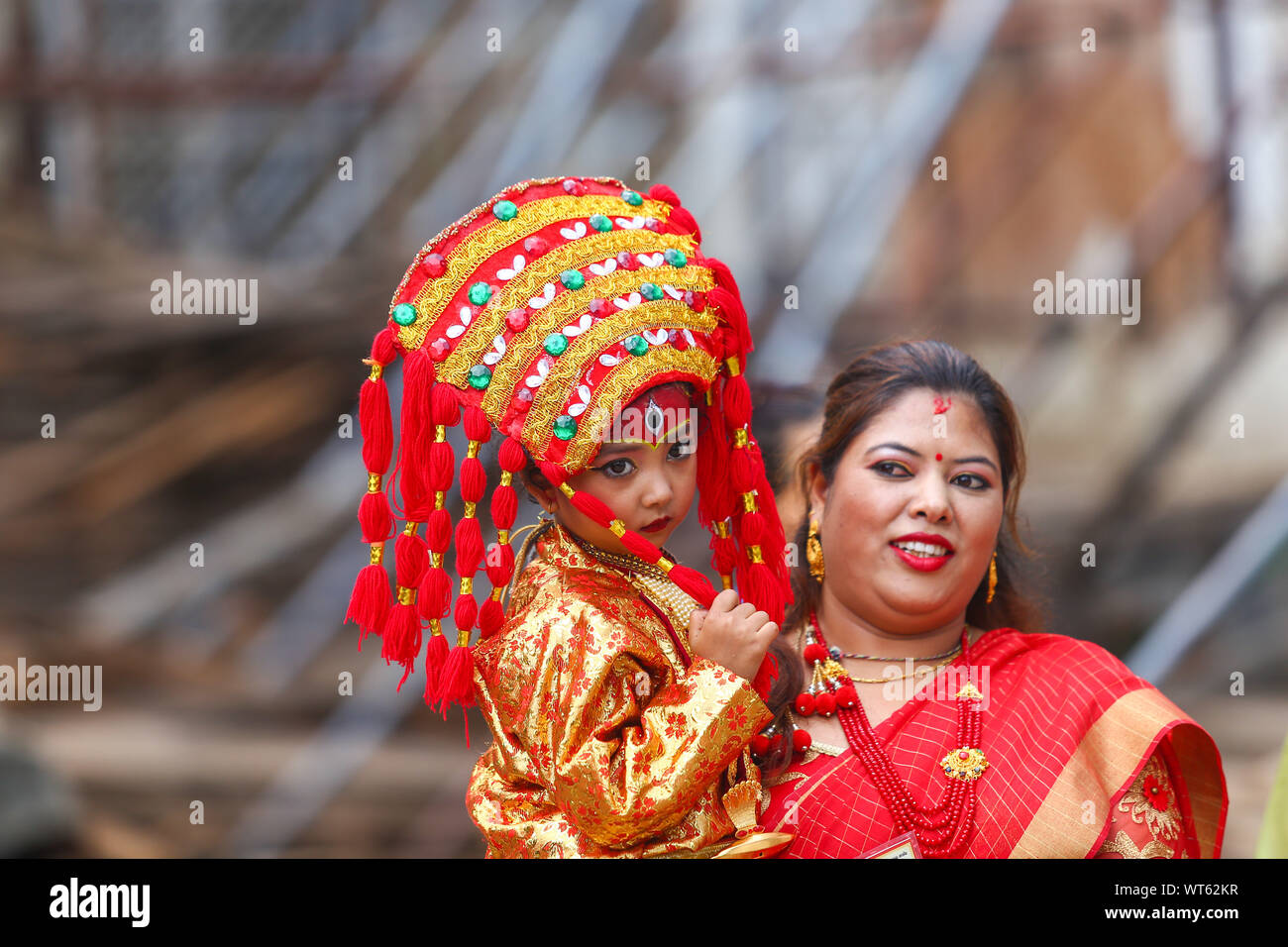 Kathmandu, Nepal. 11th Sep, 2019. A Nepalese girl dressed as a living goddess Kumari is carried by her mother during the rituals.Kumari puja is a tradition of worshipping young prepubescent girls as manifestations of the divine female energy. The ritual holds a strong religious significance in the Newar community that seeks divine blessings to save small girls from diseases and bad luck in the years to come. Credit: SOPA Images Limited/Alamy Live News Stock Photo