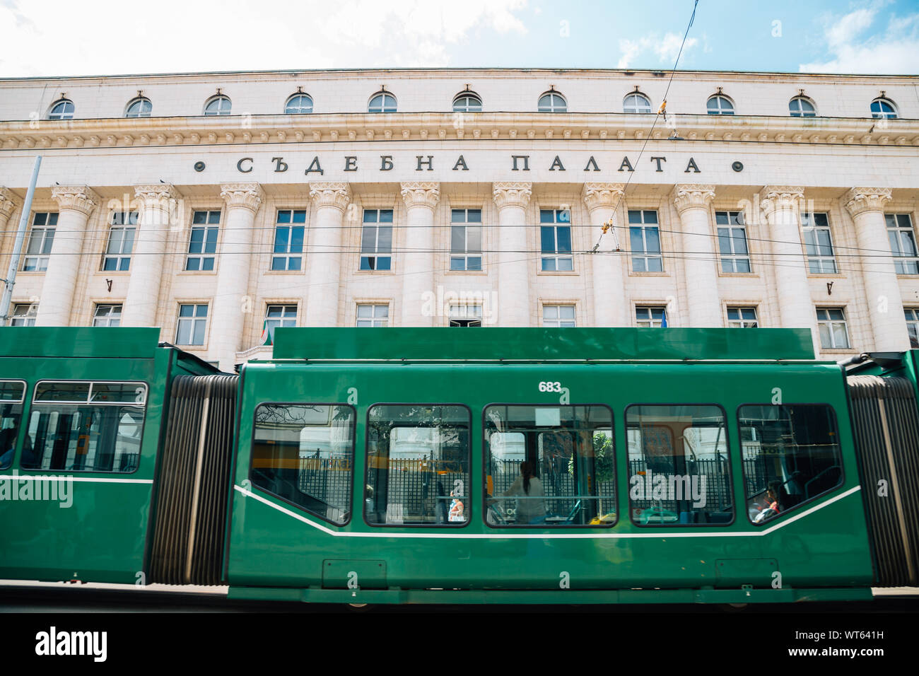 Sofia, Bulgaria - August 4, 2019 : City Court house (Palace of Justice) and green tram Stock Photo