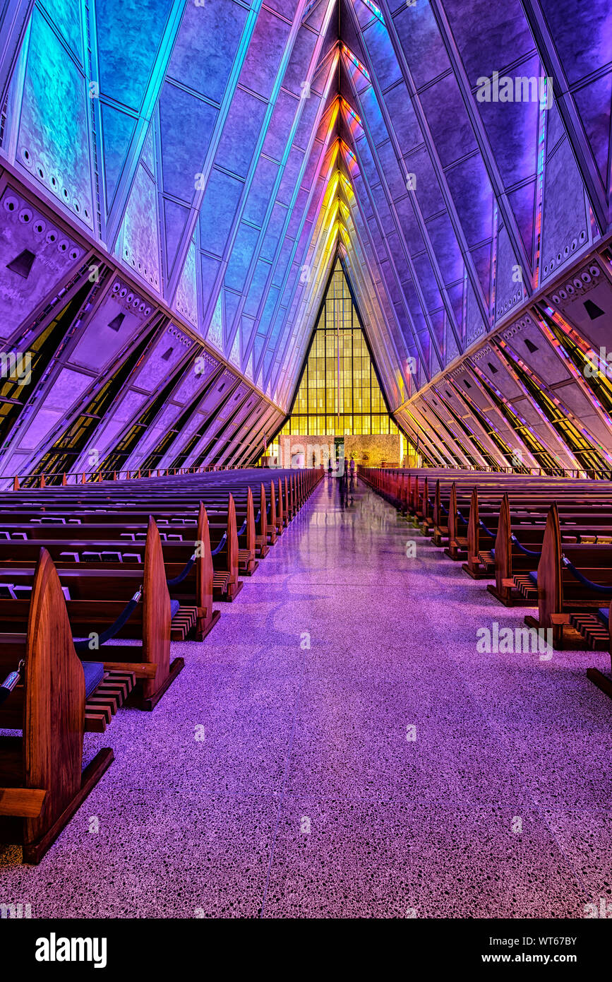 Stain Glass windows coloring the inside of the Protestant Chapel at the  US Air Force Academy, Stock Photo