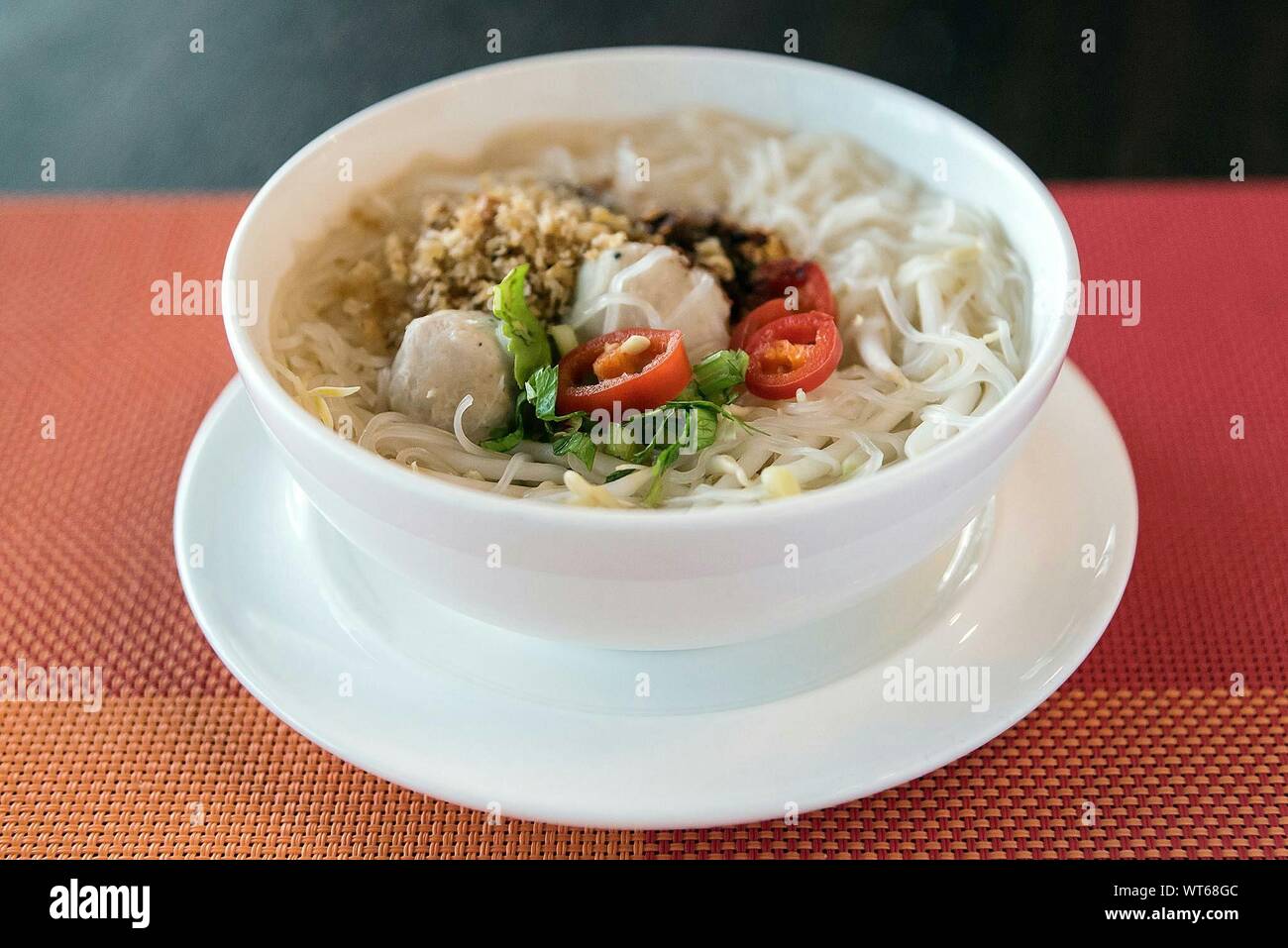 Close-up Of Noodles Served With Dumpling In Bowl Stock Photo